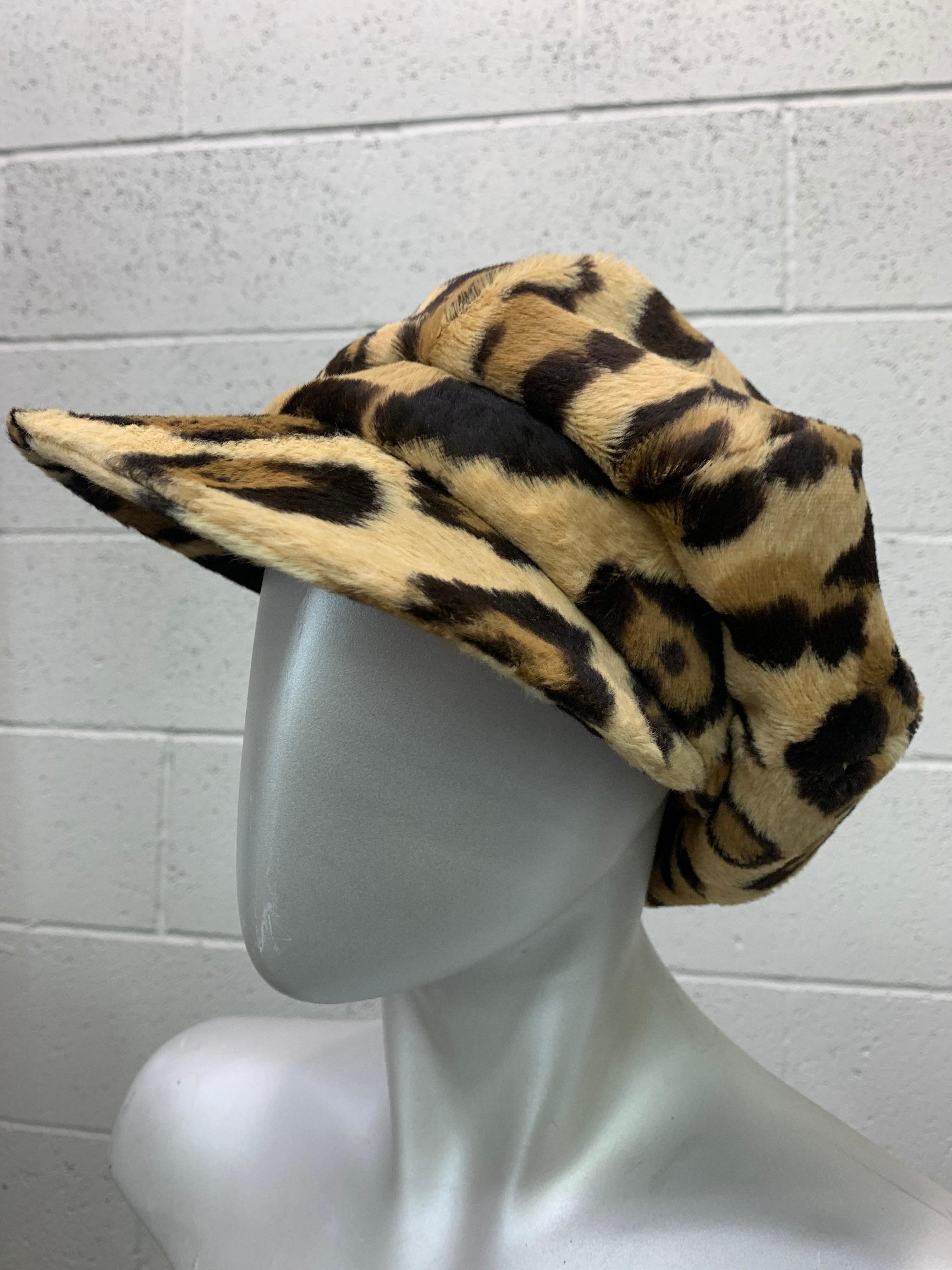 A 1960s-early 70s Adolfo Realite Mod faux leopard fur newsboy-style hat with brim and button crown. Supercool and relaxed! Size Medium. 