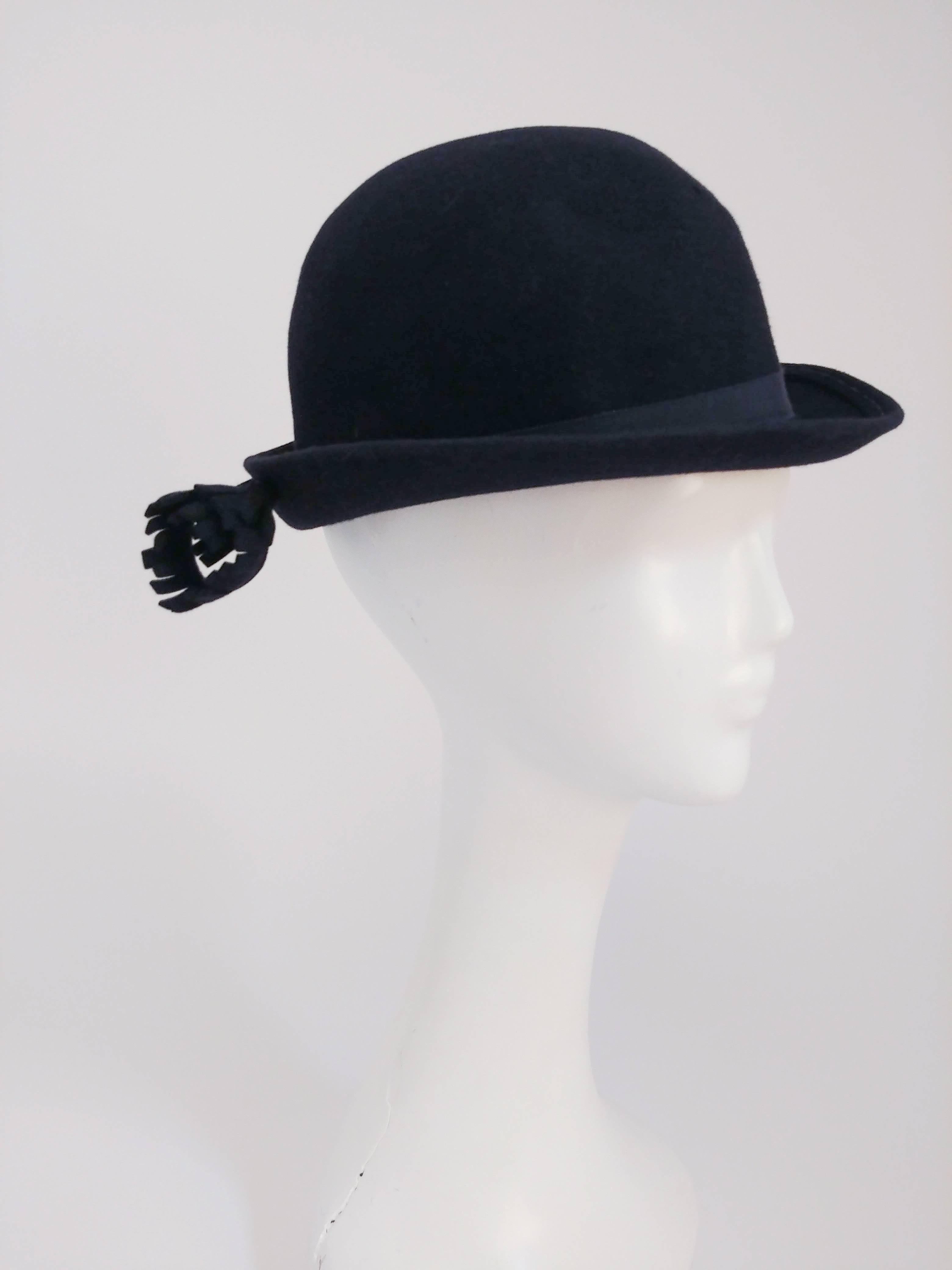 1960s Adolfo Navy Hat with Flower Accent. Navy Adolfo II for I. Magnin cashmere felt hat with grosgrain band and handmade flower accent near the back of the brim. 22+ inch circumference.