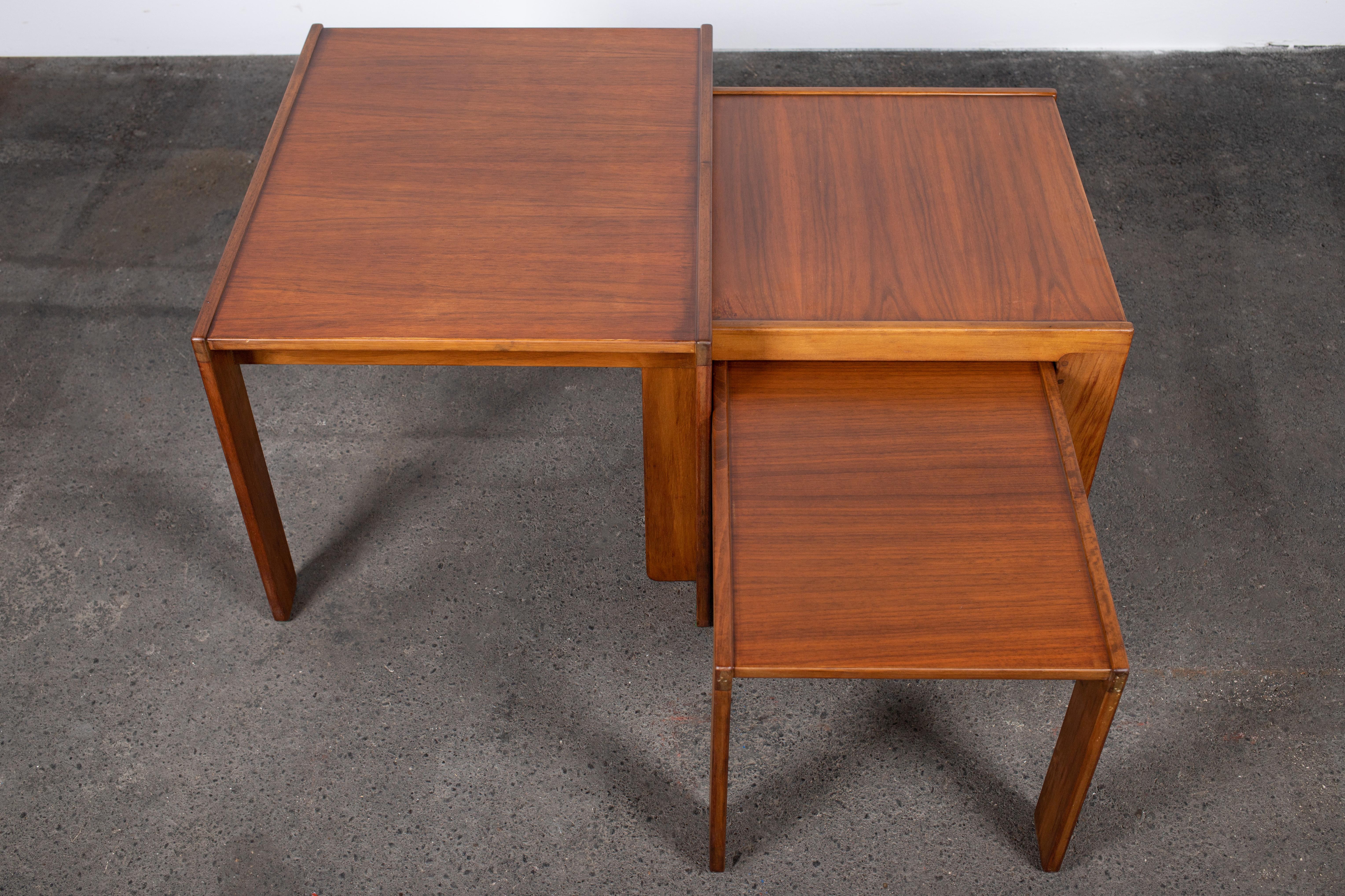 Set of 3 Mid Century Modern nesting tables in walnut by Afra & Tobia Scarpa for Cassina, 1960s.

The Scarpa genius is found in abundance within the details of this set. Not only the elegant way that they nest perfectly together or in the myriad of