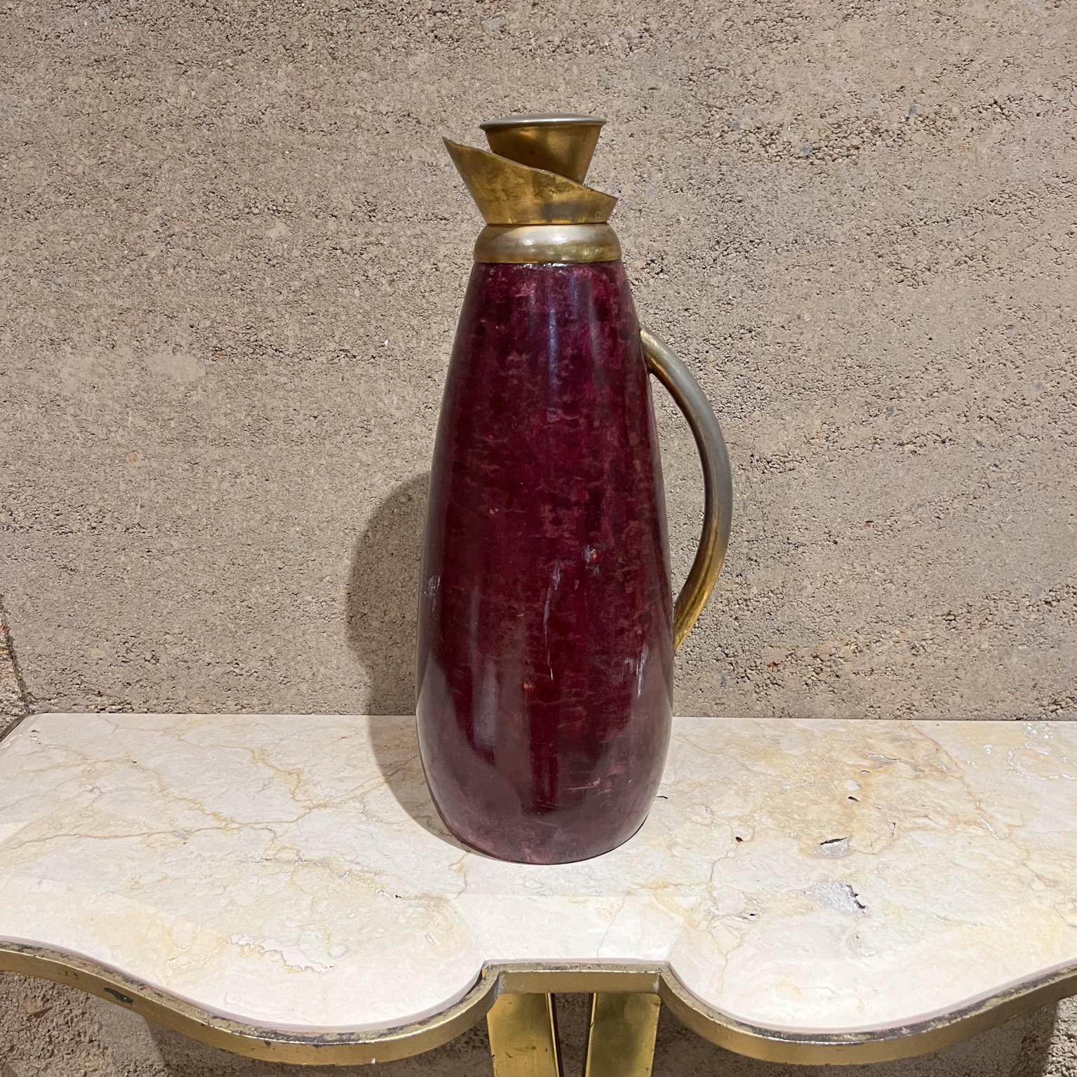 Italy 1960s Aldo Tura vintage pitcher carafe burgundy purple wine hues parchment goatskin
Handle and cork stopper in brass plated metal.
Label from the maker.
14.5 h x 6 d x 5 diameter
Please expect preowned original unrestored vintage