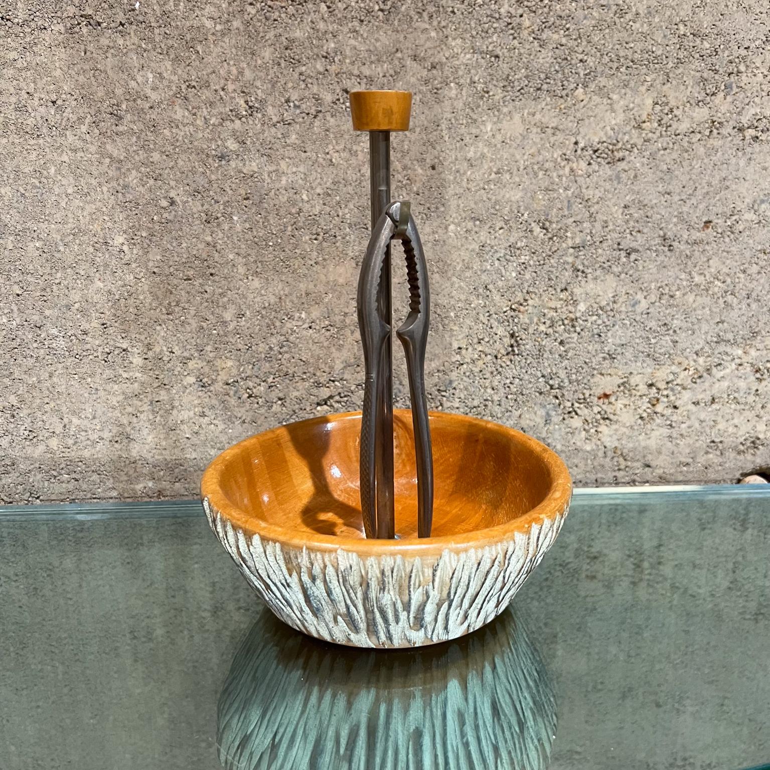1960s Aldo Tura Sculptural Wood Bowl with Stainless Steel Nutcracker Macabo ITALY 
Nutcracker tool included.
Bowl has a center stem with hook to place nutcracker.
8.5H x 6.63 in diameter
Maker Stamped Macabo designed by Aldo Tura
Original Unrestored