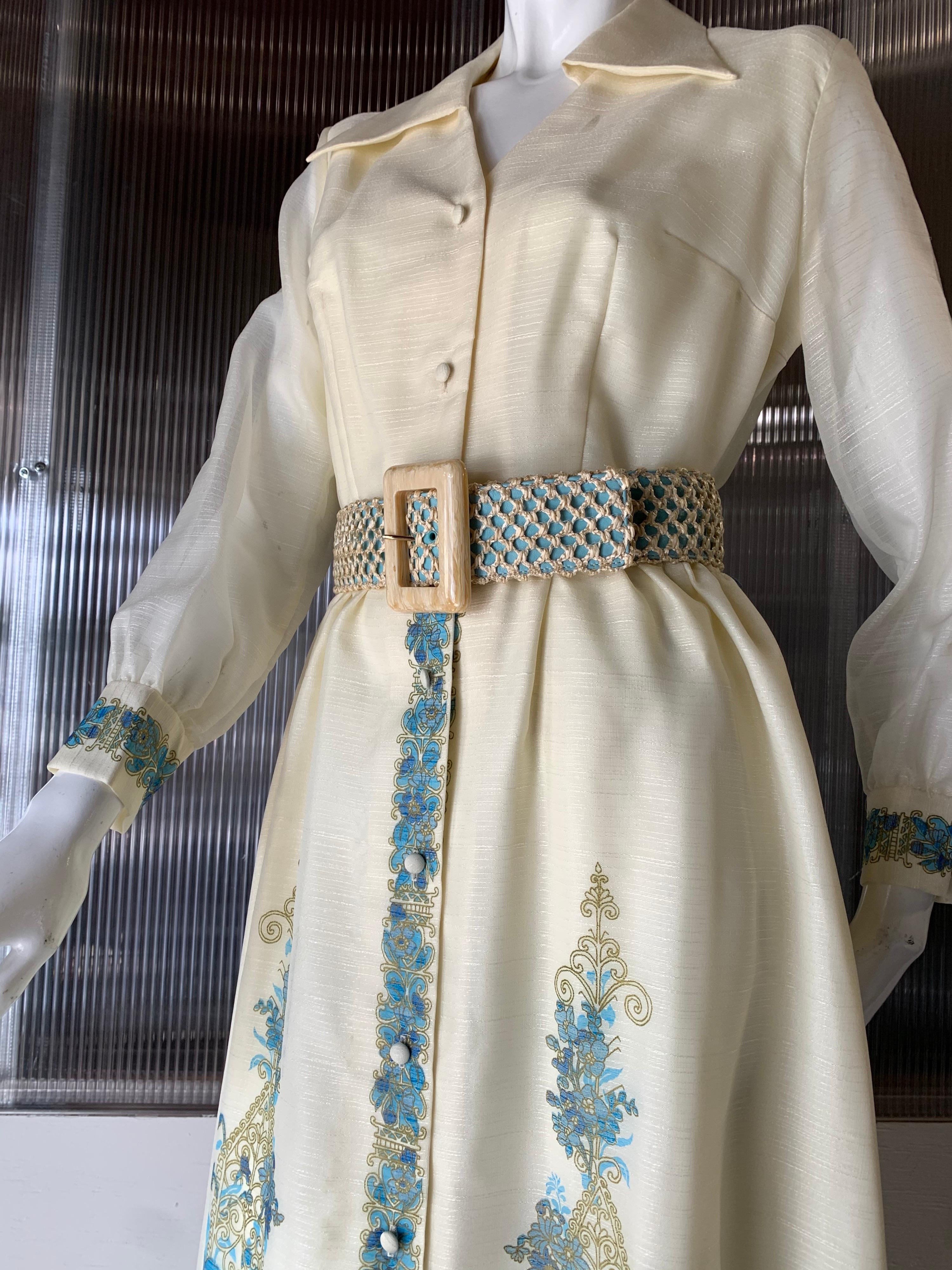 1960s Alfred Shaheen ivory hostess maxi dress with turquoise Polynesian print on skirt and cuffs. Button down front style. Original braided belt. Never worn.