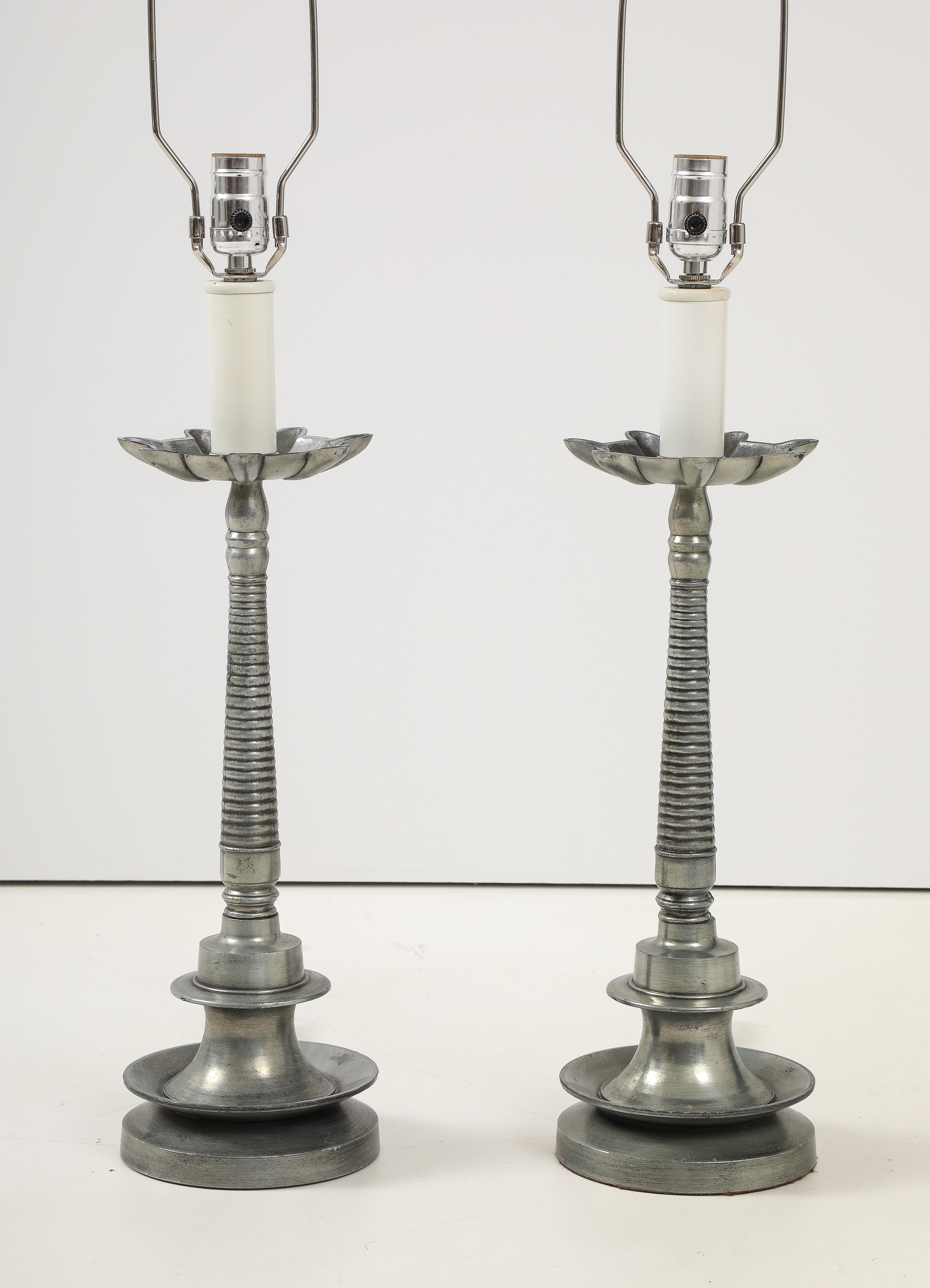 1970's modern French aluminum table lamps with original finial, in vintage condition newly rewired and ready to use, with minor wear to the aluminum due to age and use.