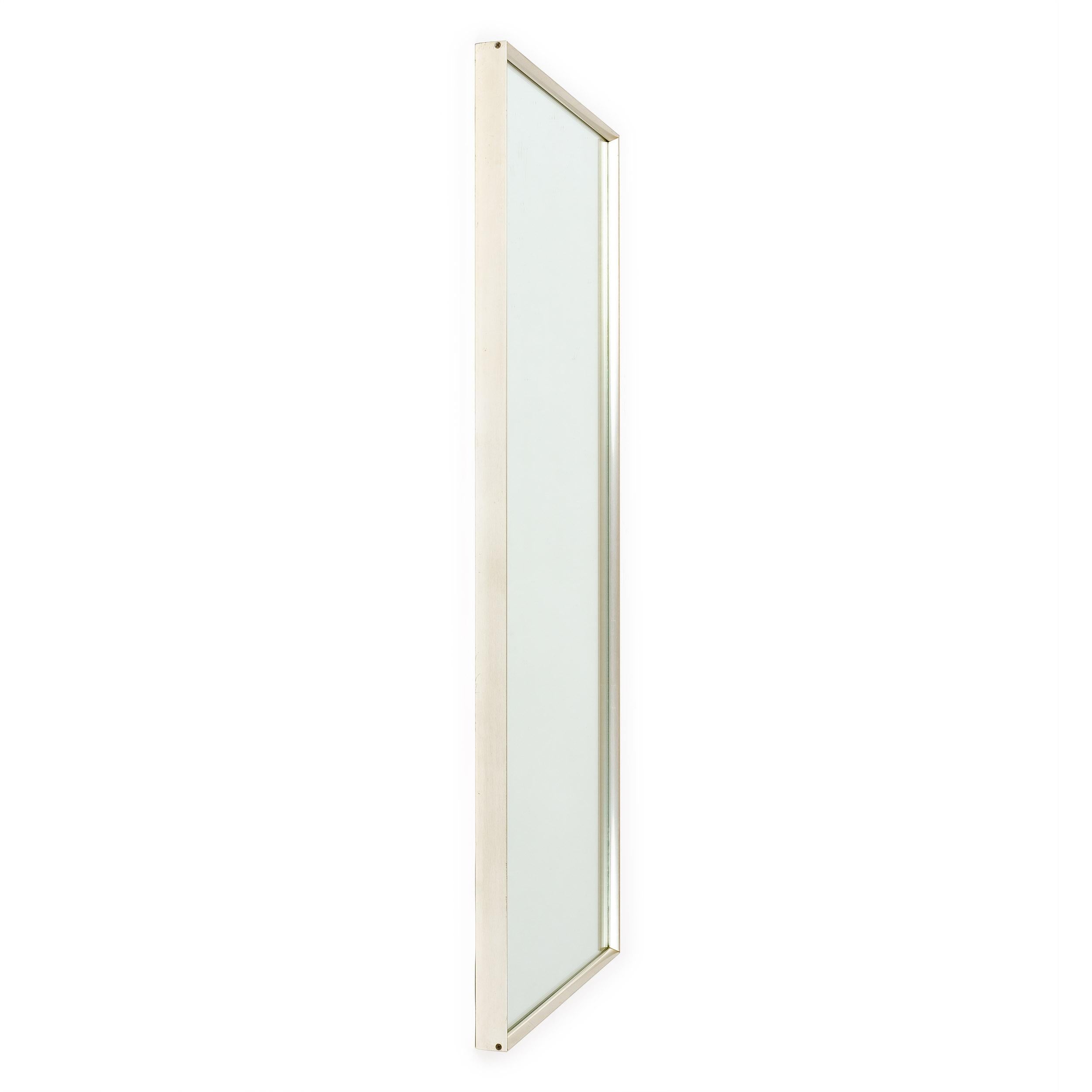 Wall mirror designed by Renzo Rutili for the Hart Division of the Donnelly-Kelley Glass Company, Holland, MI, circa 1960s. Anodized aluminum frame in a bright pewter finish with the framing strips themselves having a unique end profile design