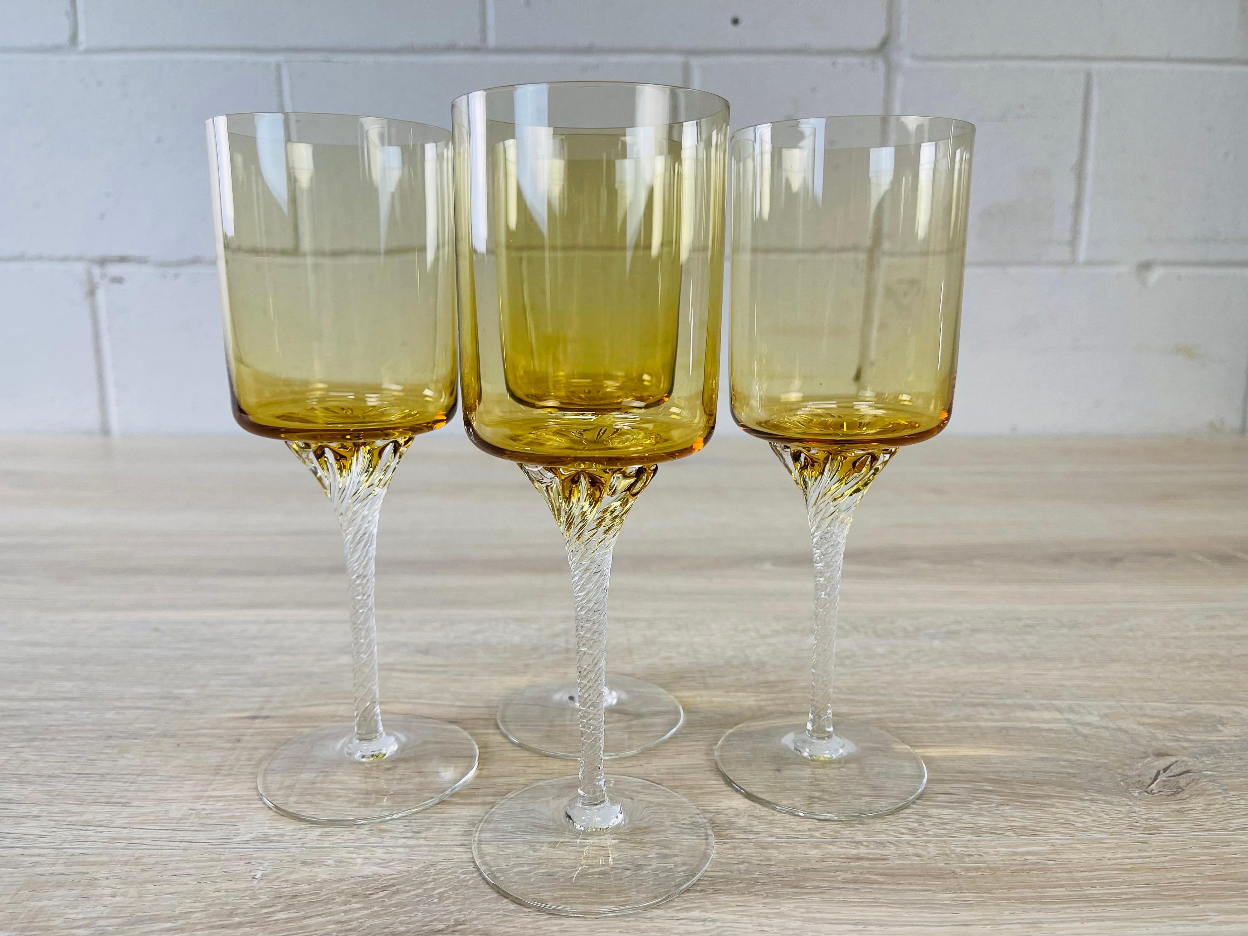 Vintage 1960s set of 4 tall amber glass wine goblets with twisted stems. No marks.