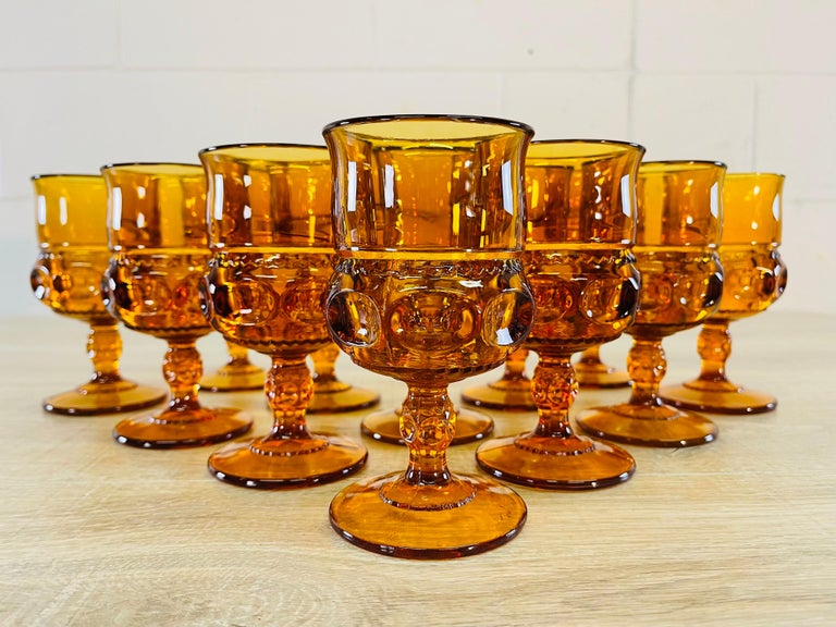 Vintage 1960s set of 12 amber thick glass thumbprint water stems. No marks.