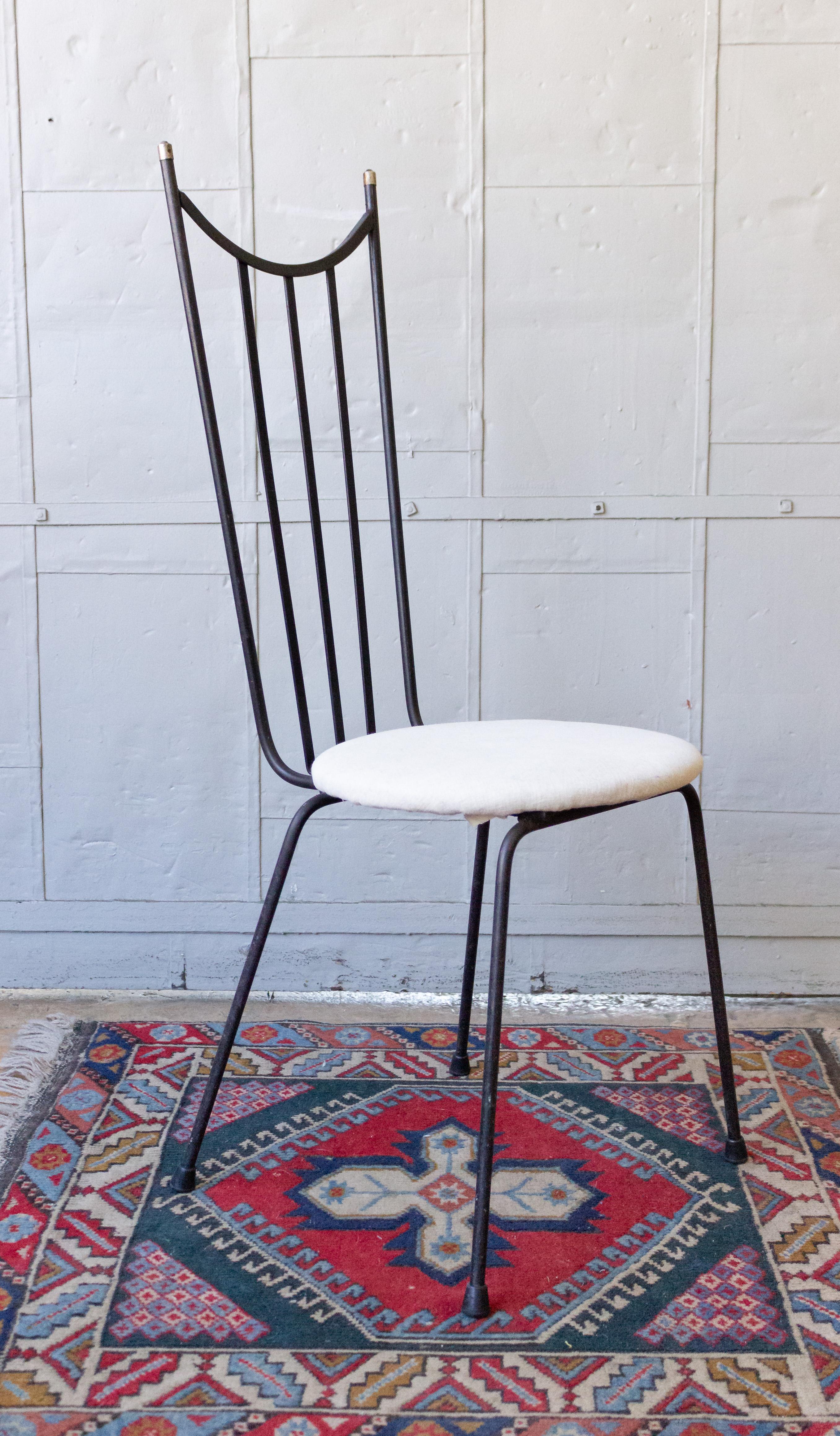 Mid-Century Modern side chair made of iron with round linen seat.