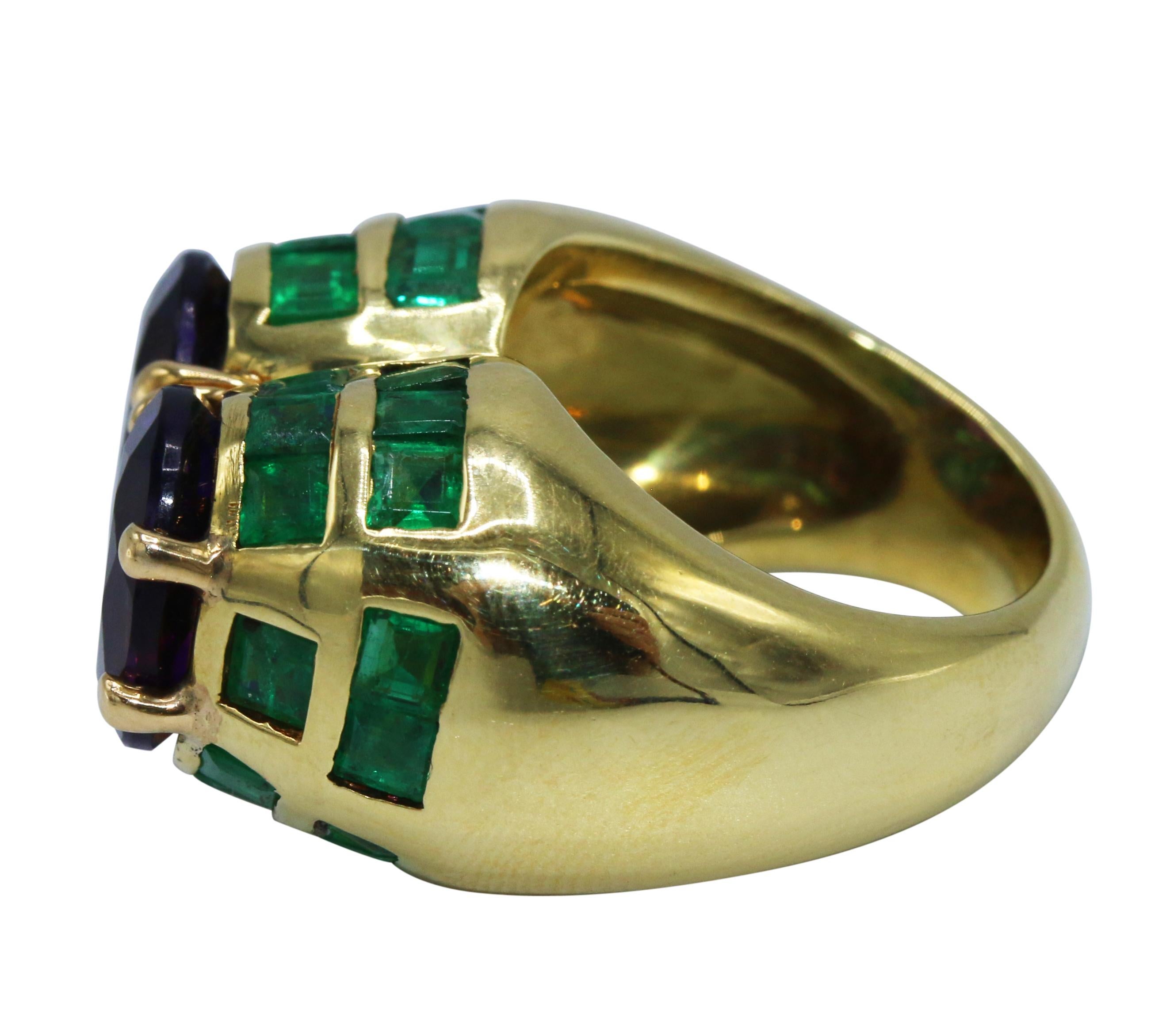 18 karat yellow gold, amethyst and emerald ring, circa 1960s, set with 2 round amethysts, framed by channel-set calibré-cut emeralds, size 5, signed I. ZINGG Sagzingg.
A stylish cocktail ring set with a unique color combinations of purple and green