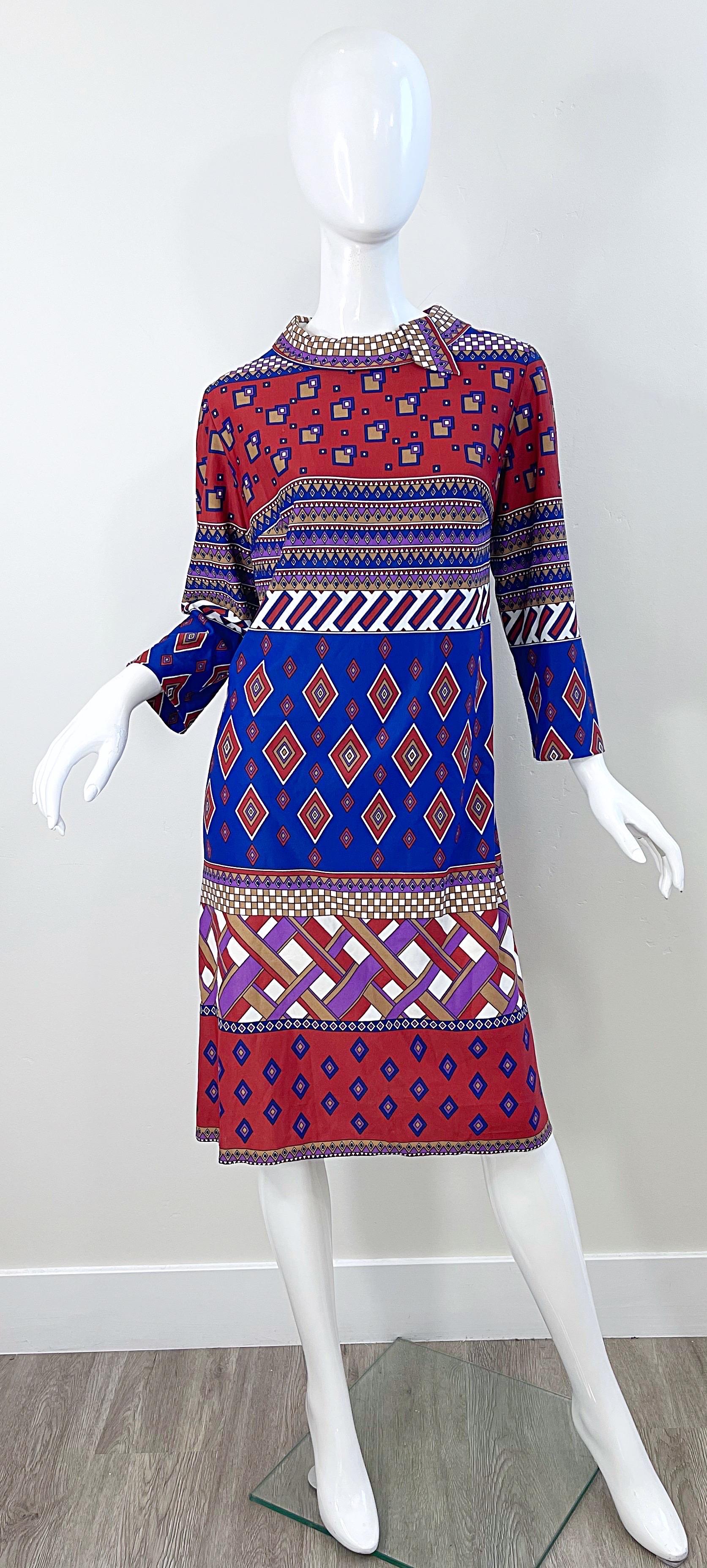 Amazing 1960s AMY ADAMS for B. ALTMAN abstract print knit dress ! Features warm colors of brown, blue, burnt orange, and purple throughout. Abstract squares, diamonds, rectangles and stripes. Hidden zipper up the back with hook-and-eye closure. 
Can