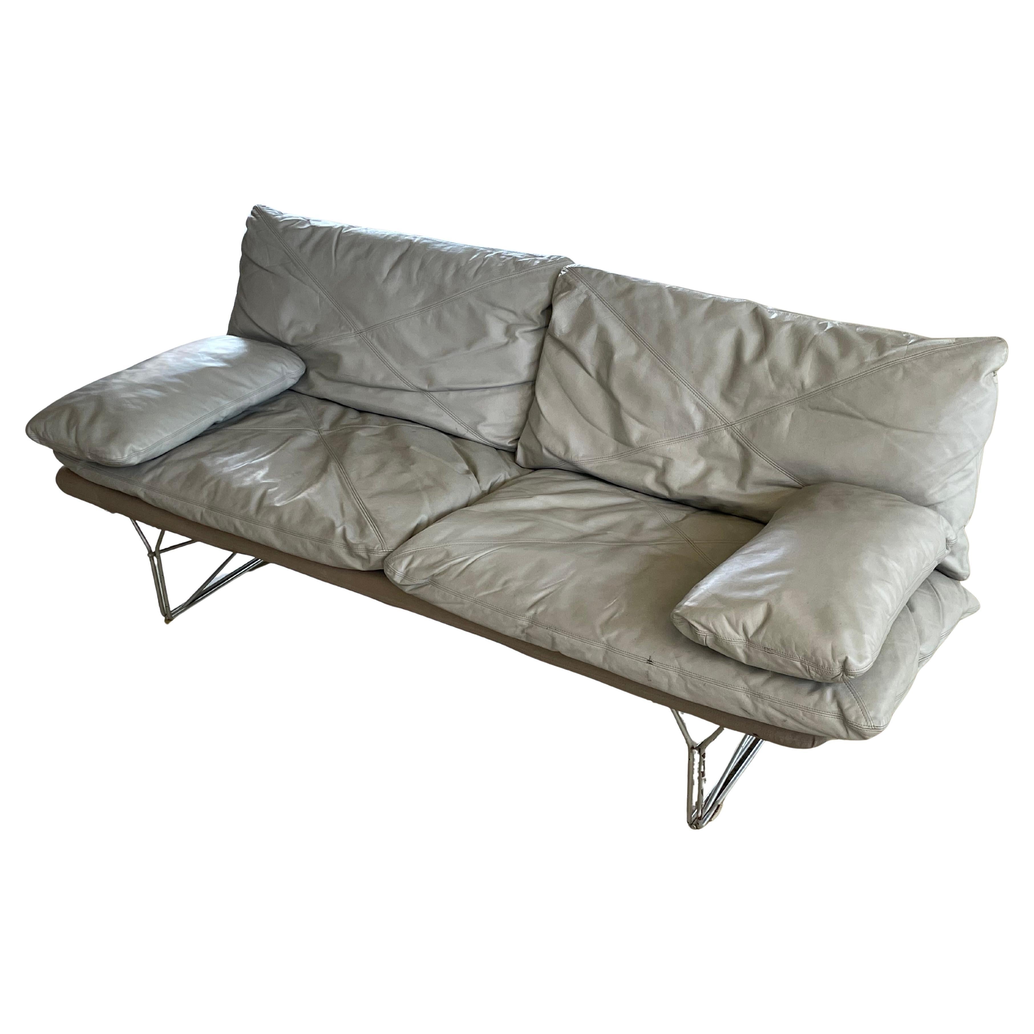 IKEA ‘MOMENT’ leather Sofa designed by Niels Gammelgaard, 1985. Aluminium base with grey leather padded seat and backrest with two additional armrest cushions.
“The world’s first flat-pack sofa was called MOMENT seating furniture. It adorned the