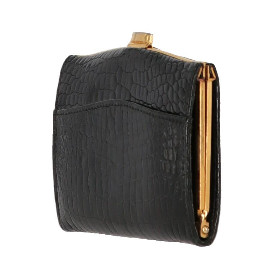 A.N.G.E.L.O. Vintage Cult black french crocodile skin coin purse, flat model with gold-tone metal snap lock. It features a open front pocket, and a folding inner design with two compartments.

Item shows very light signs of wear on the hardware, as