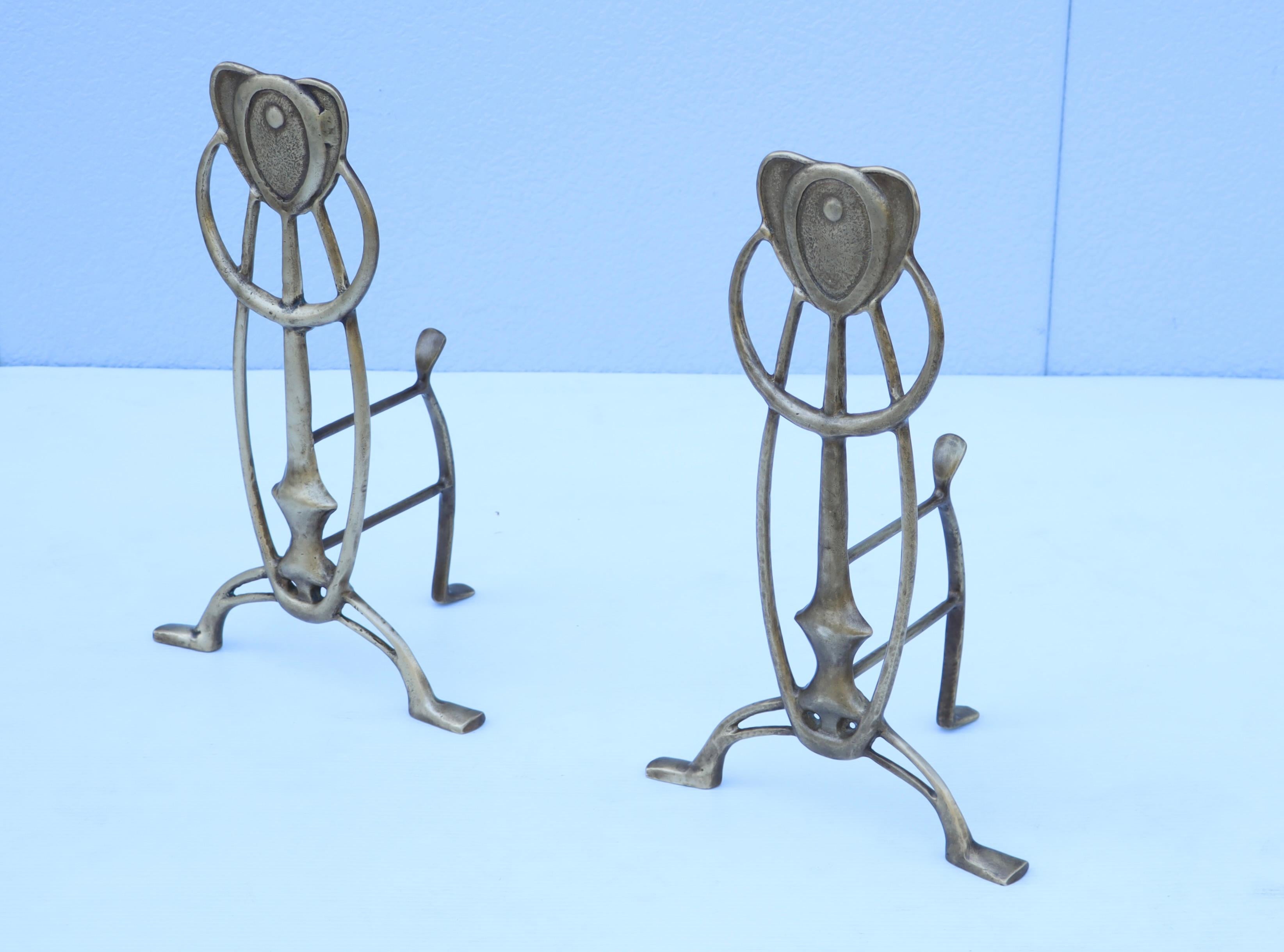 Nice pair of 1960's solid brass animal abstracts andirons, in vintage original condition, with minor wear and patina due to age and use lightly hand polished.