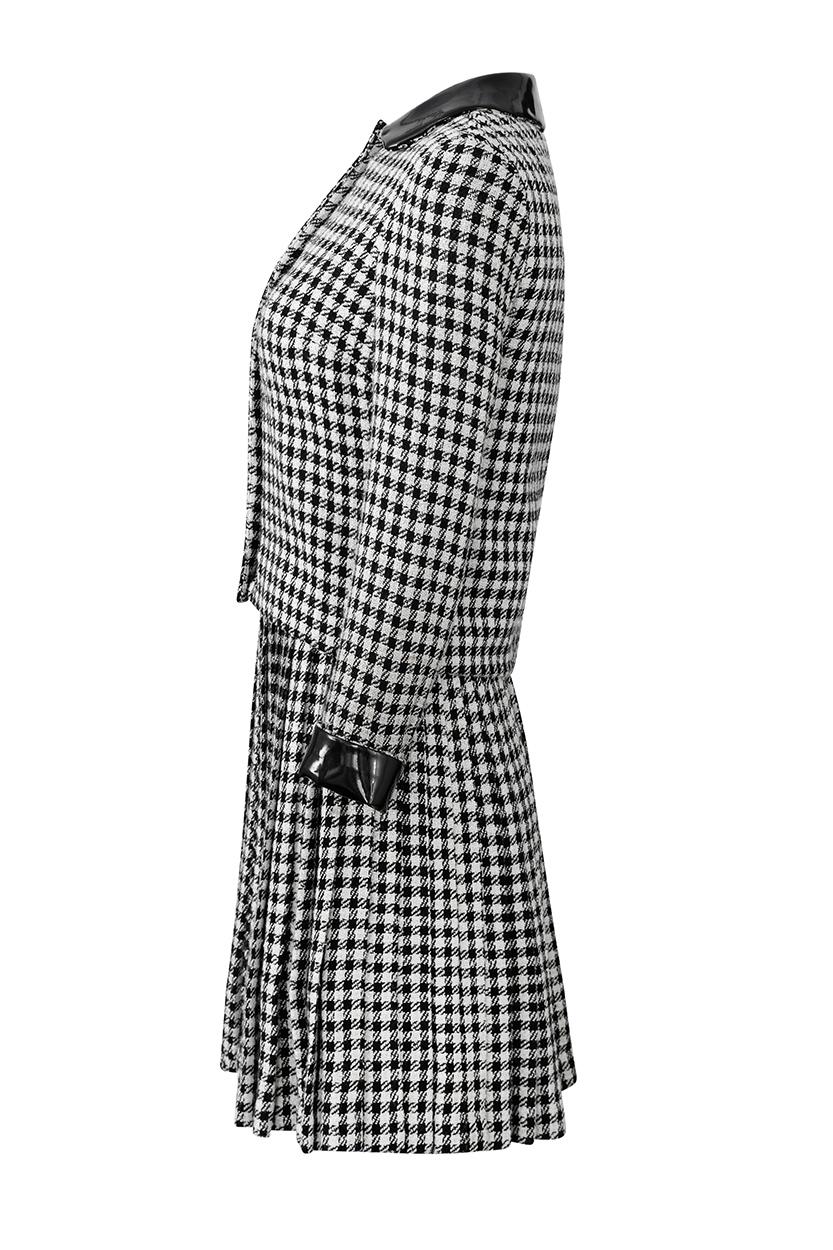 This stylish 1960s wool check plaid twin set in monochrome tones is by American designer Anne Fogarty for The Grey Shop, Boston. The set is comprised of a sleeveless dress and matching jacket both in black and white wool check plaid with a hint of