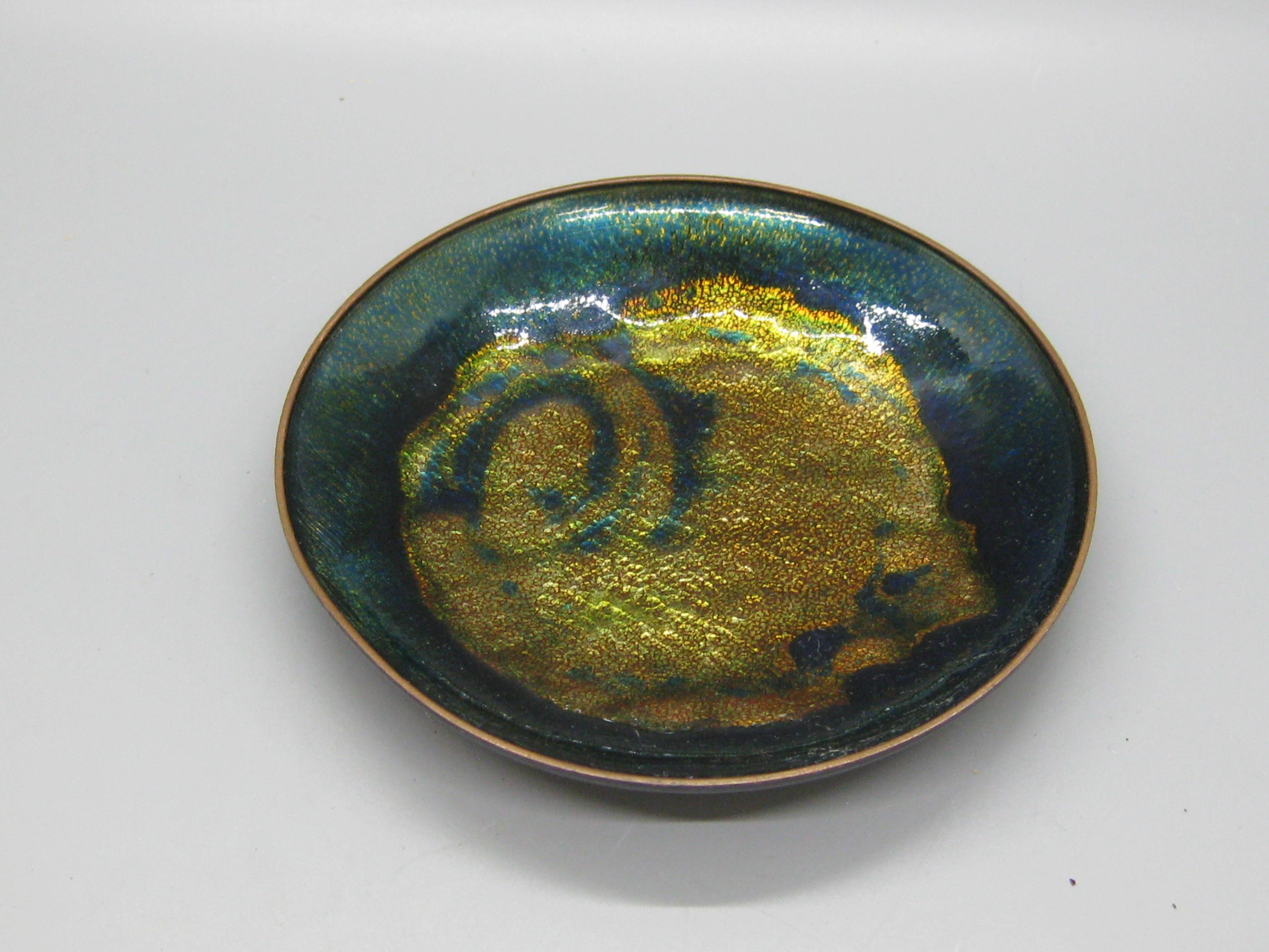 Great hand made enamel on copper dish by Norwegian artist Anne-Grete Ploen and dates from the 1960's. Made in Norway and is signed on the bottom. Great abstract design and wonderful color. In very nice original condition. Measures 5 1/8