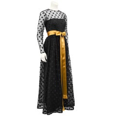 1960s Anonymous Black Long Sleeve Gown with Polka Dot Net Overlay and Gold Sash