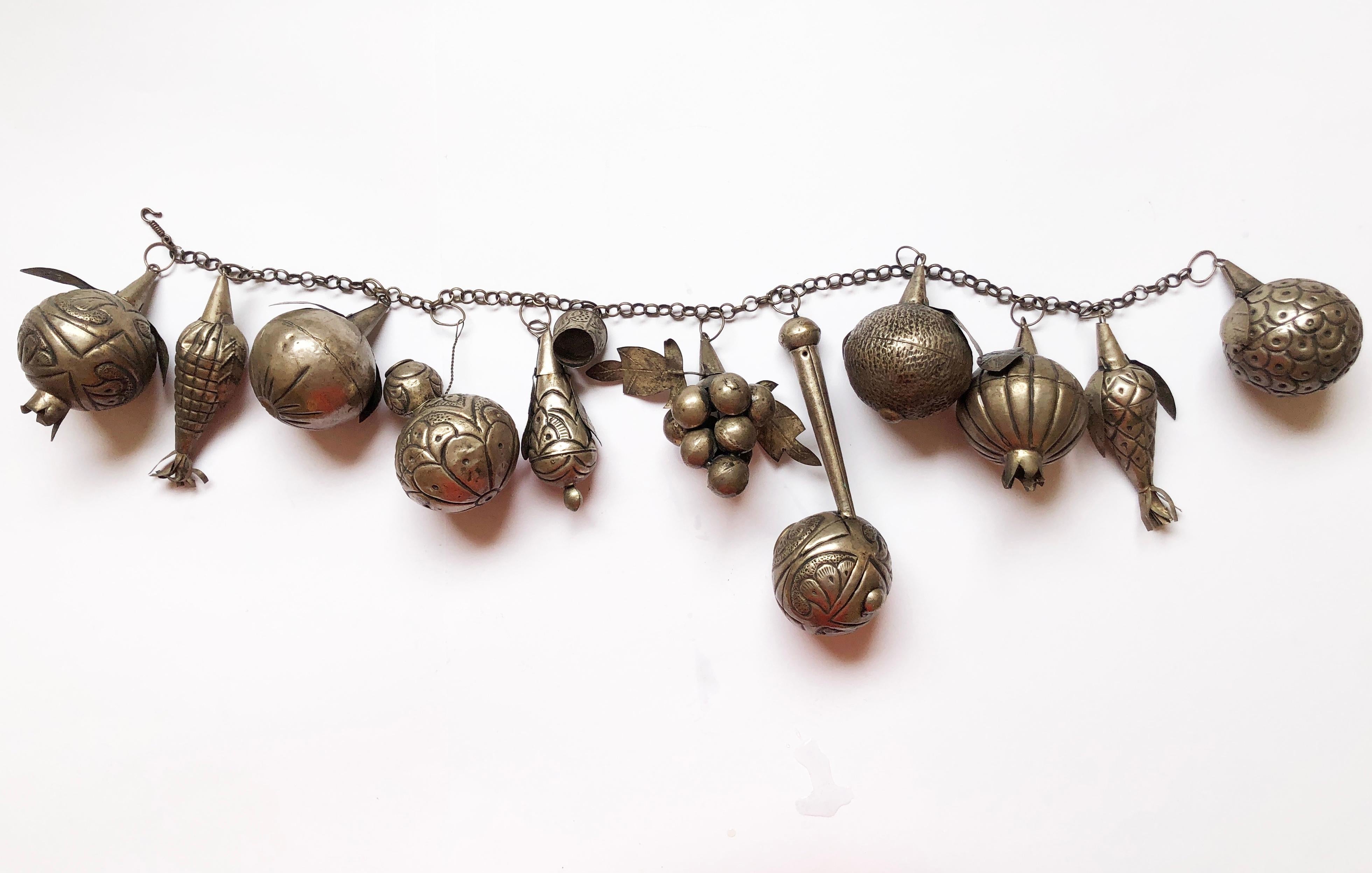 Absolutely unique very large creole 'Penca De Balangandan' from Brazil from around 1960.
Tin base, possibly silver plated.
Traditional slave amulet filled with protective & symbolic charm.
Often carried by (Afro-Brazilian) Bahian women in