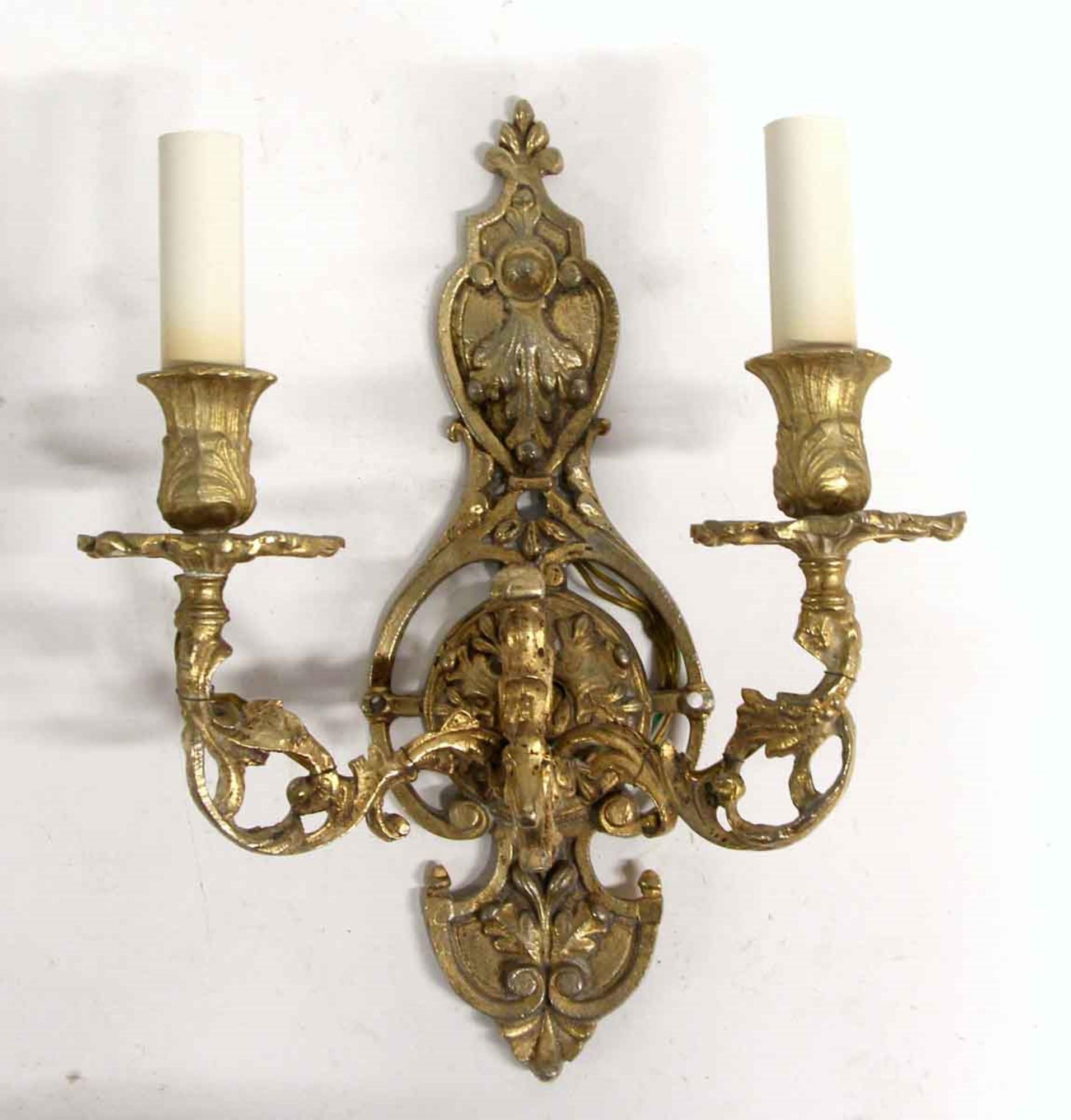 Antique 1960s French two arm ornate sconces made from cast brass. Priced as a pair. This can be seen at our 400 Gilligan St location in Scranton. PA.