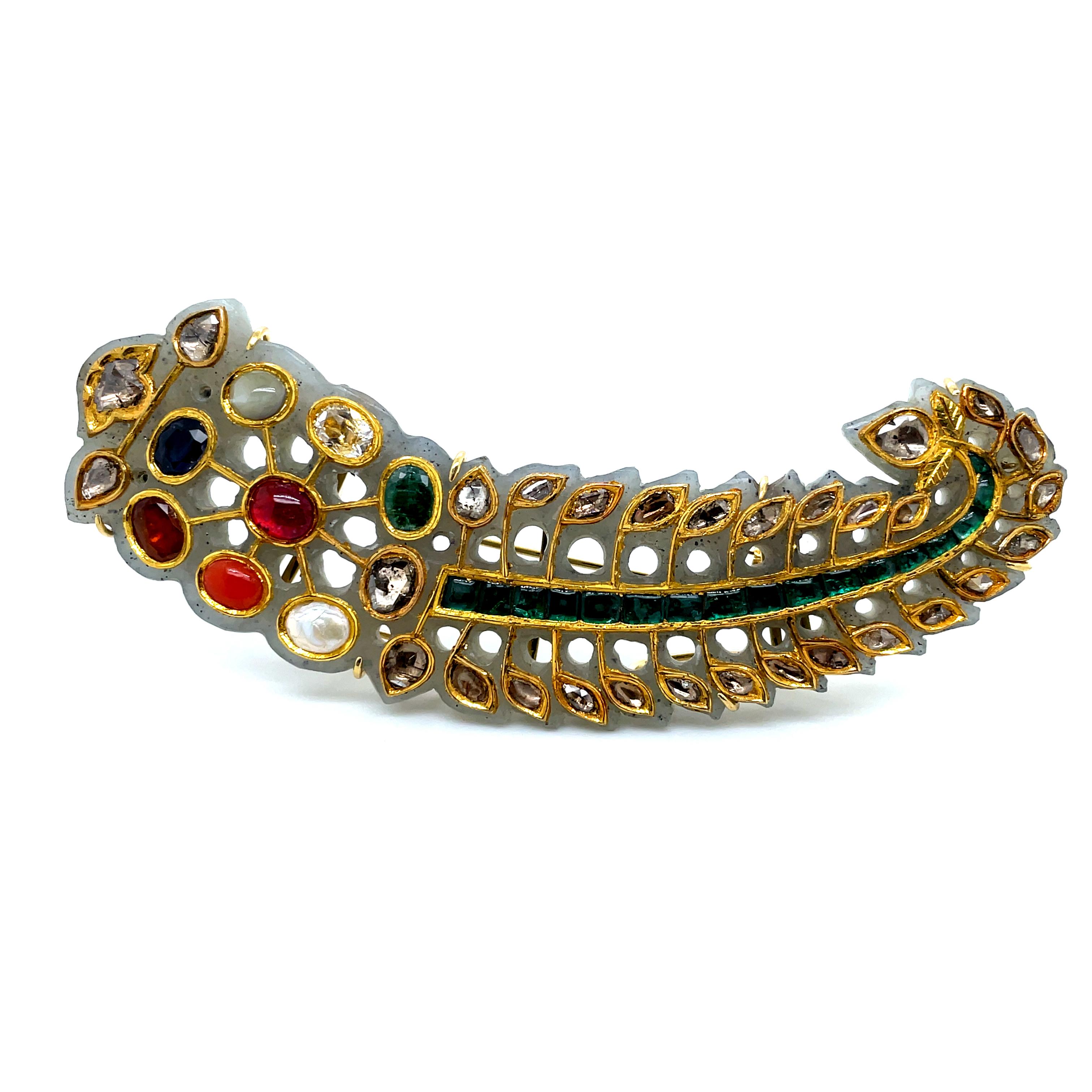 1960s Antique Turban Ornament (Sarpech) Brooch With Navratna (9) Stones on Nephrite With
Diamonds

This antique Turban Ornament, from the 1960s also known as a Kilangi or Sarpech is a captivating blend of craftsmanship and artistic