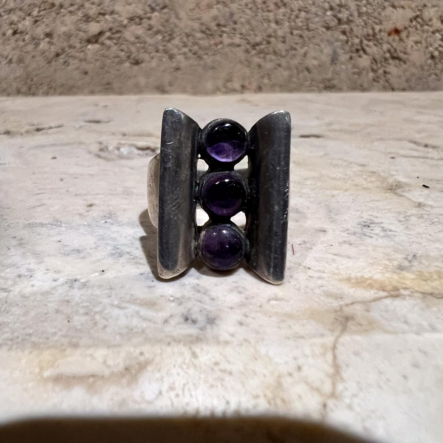 For your consideration Ring by Antonio Pineda Mexican Modernist. 
Amethyst Sterling Silver Mexico circa 1960s
Beautiful clean modern lines. 
1 H x .88 W x .75 D
Ring size 7.75
Please visit take a look at our listings, we have an amazing, curated