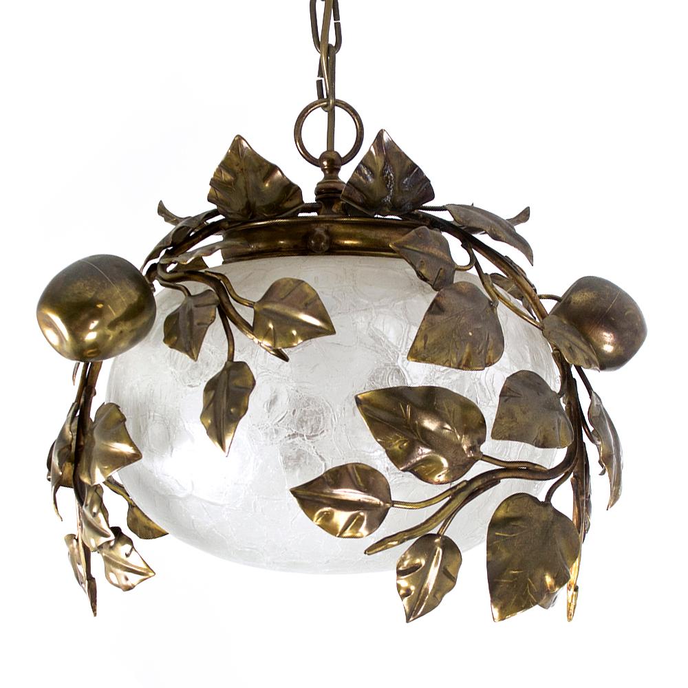 Highly decorative golden Hollywood Regency style brass and glass pendant lamp from the 1960s.
The glass shade is covered with brass branches, leaves and apples.
The sculptural pendant light creates a very pleasant light.
A truly rare and