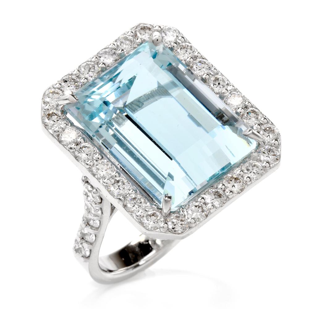 This captivating estate cocktail ring exposes a prominent 16.85 ct. emerald-cut aquamarine measuring 16 x 13 mm. The natural beryl aquamarine with the color of the sea on a warm tropical day or that of the earth's important life-giving forces,