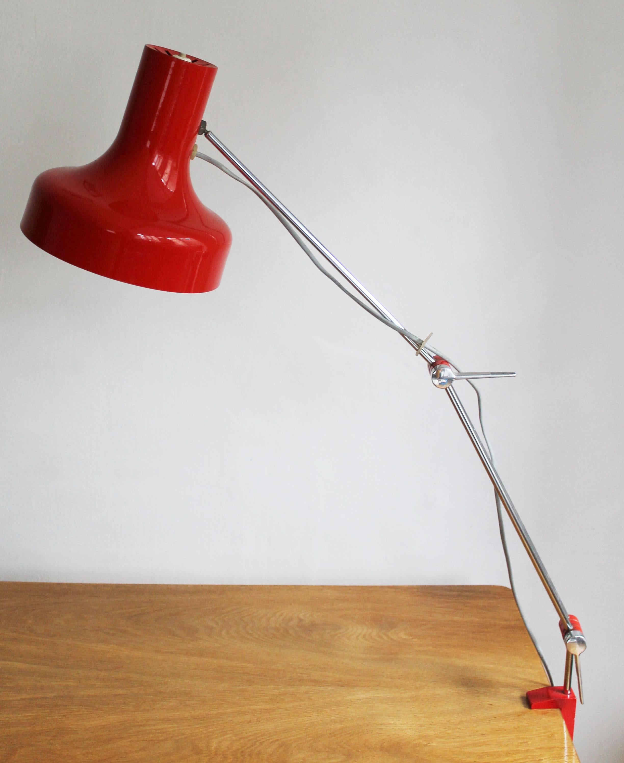 This bright red adjustable lamp was designed by Napako Lightning company in the 1960’s Czechoslovakia. It’s designer, Josef Hurka is considered by many as the most talented and commercially most successful Czech lighting designer of the second part