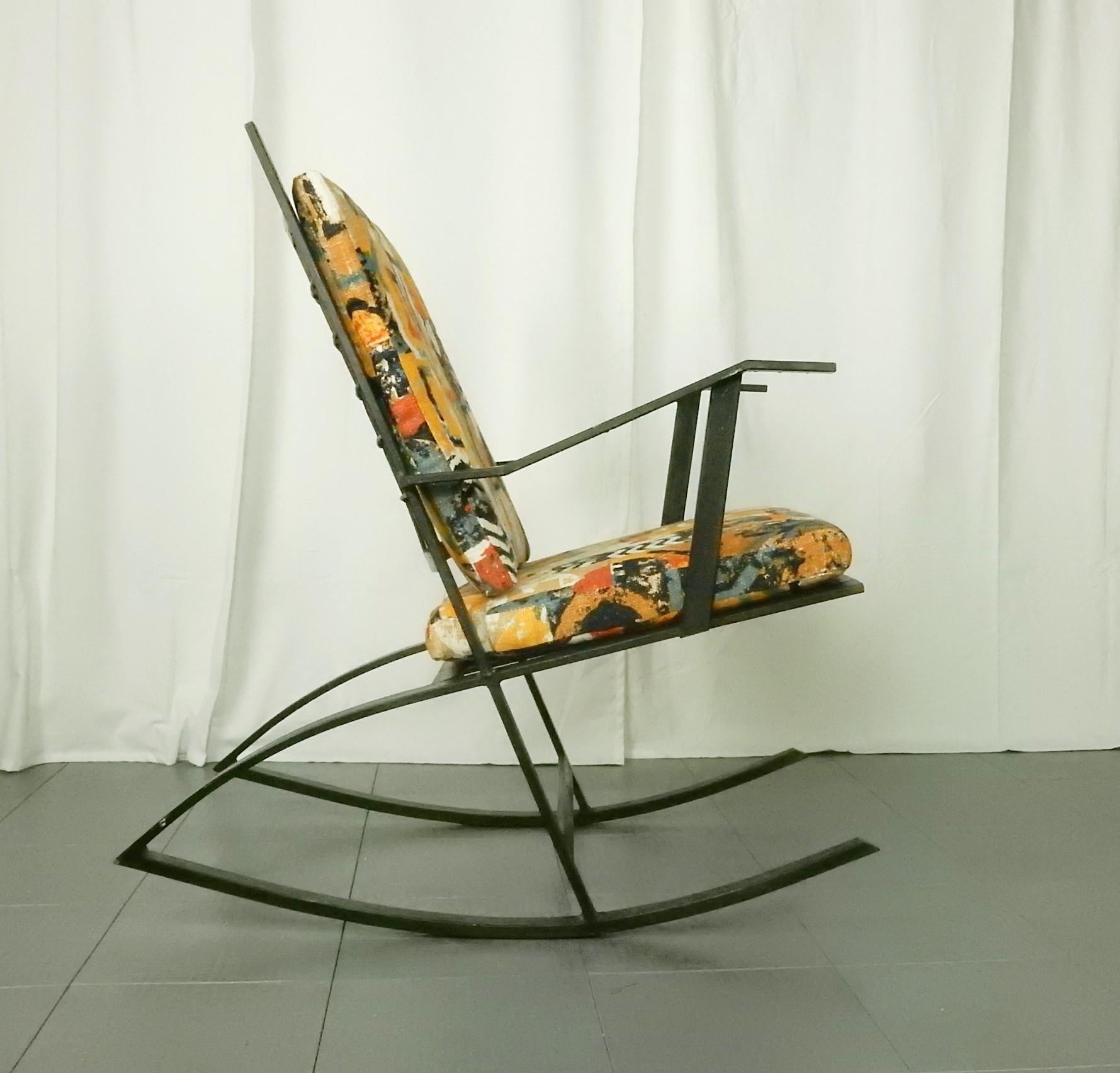 Sculpted steel rocking chair in the manner of Fredrik Kayser teak model, circa 1960s
Solid welded steel construction.
Gorgeous graphic linen fabric seat and back cushions.
One of a kind, comfortable functional piece of art.
