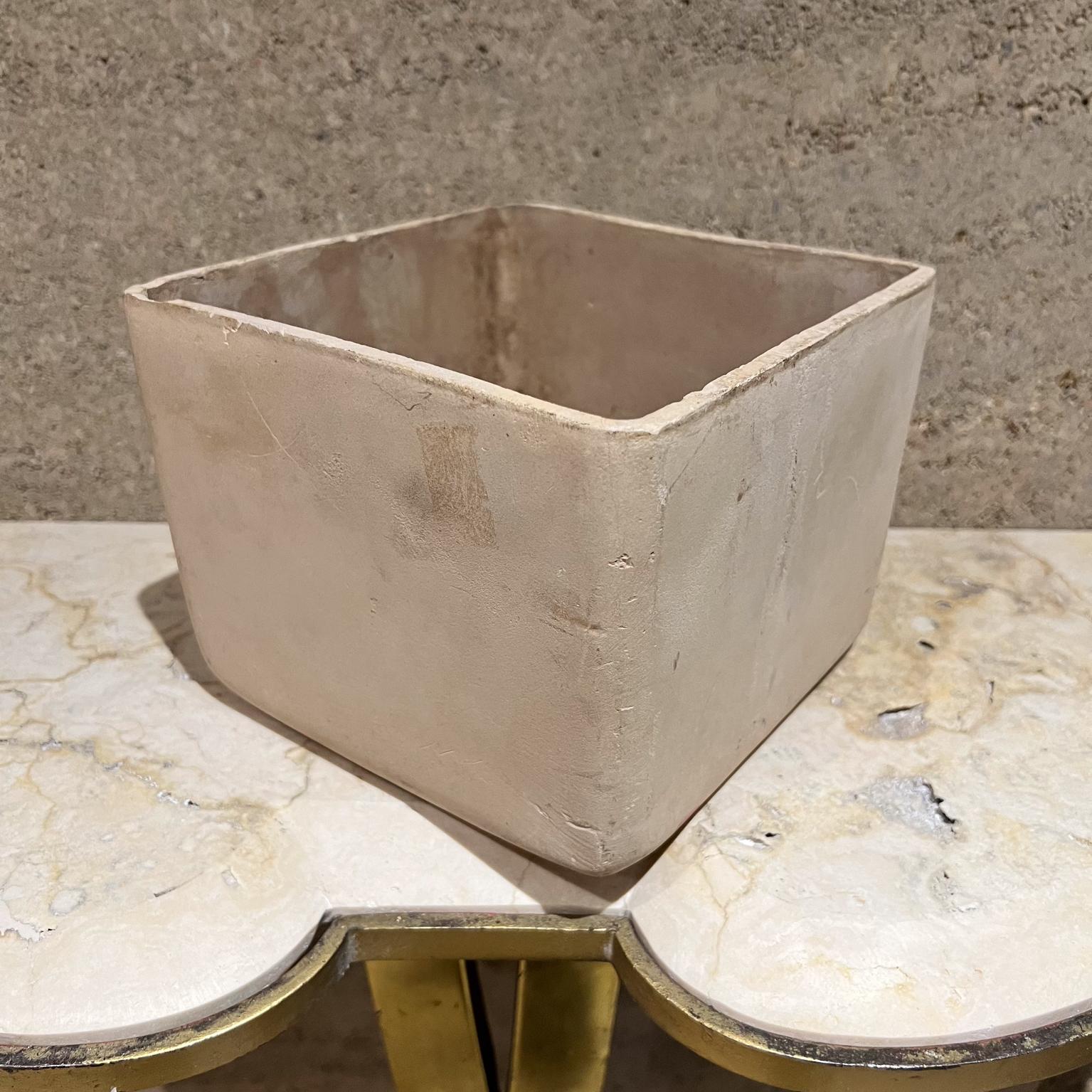 midcentury modern Cream Bisque Pottery Planter attributed to John Follis designs Architectural Pottery
Stamped underneath with makers logo ADAM Ceramics USA.
7.25 x 7.25 x 5.5 Tall inches
Unrestored Preowned Vintage Condition.
Presents with