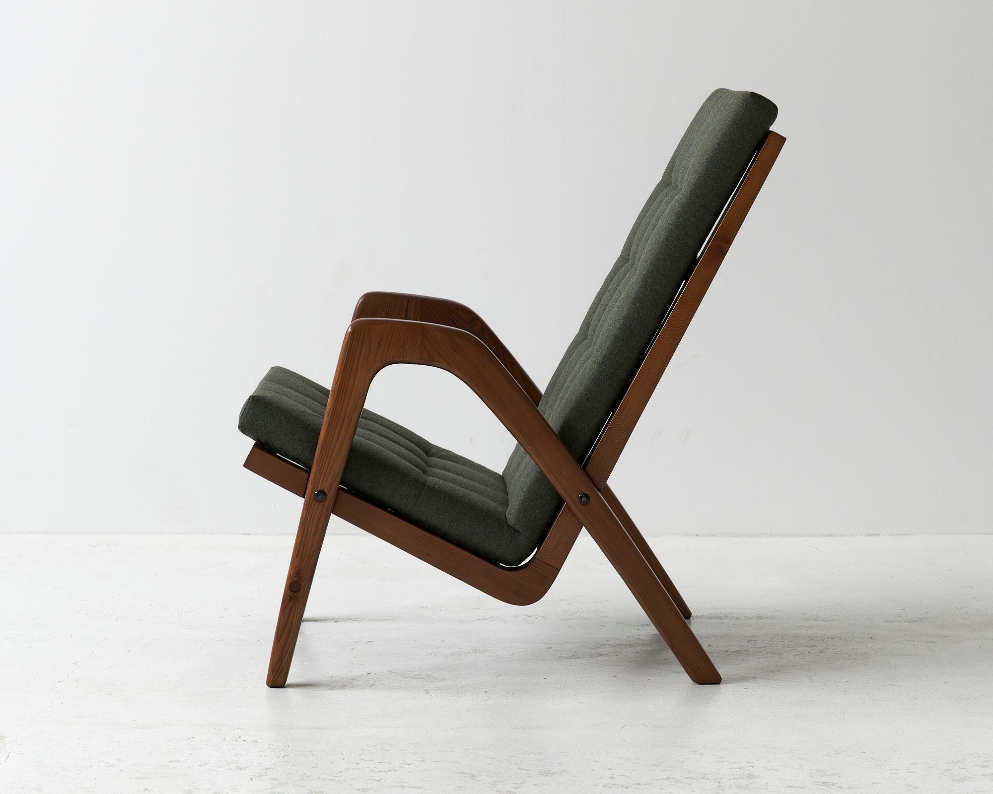 1960s armchair designed by a great czechoslovakian architect Jan Vaňek for ULUV.

Striking oak wood frame. Seating recreated and covered with high quality olive synthetic wool.