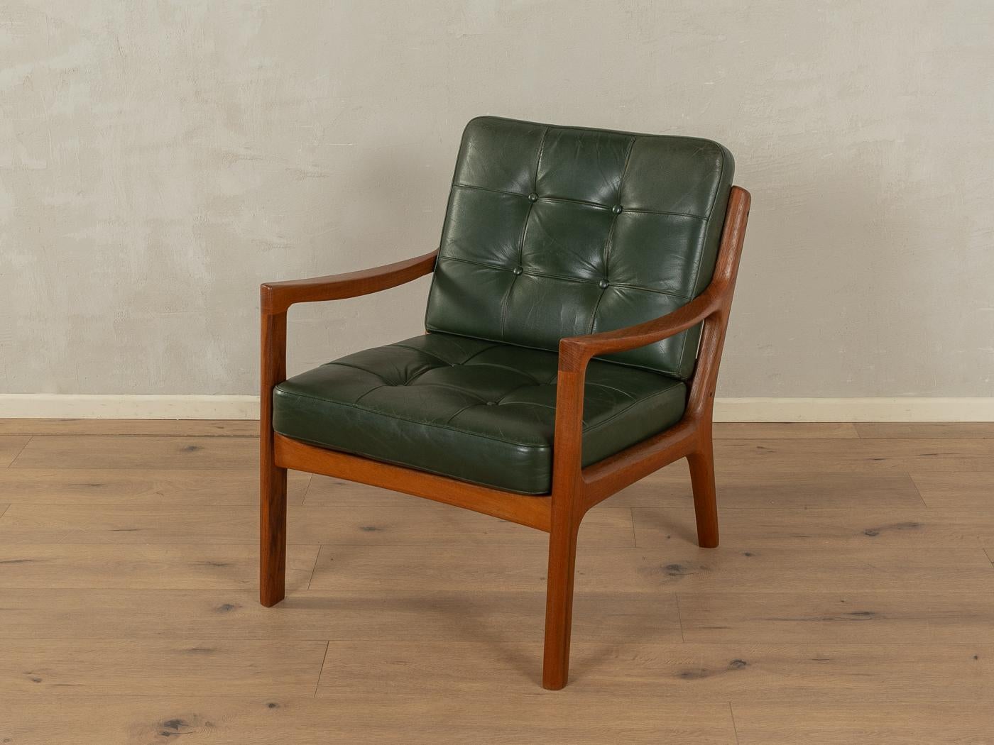 Klassischer Sessel aus den 1960er Jahren. Modell Senator von Ole Wanscher für France & Søn. Hochwertiger massiver Teakholzrahmen und Kissen mit originalem Lederbezug in grün.

Qualitätsmerkmale:

Vollendetes Design: perfekte Proportionen und