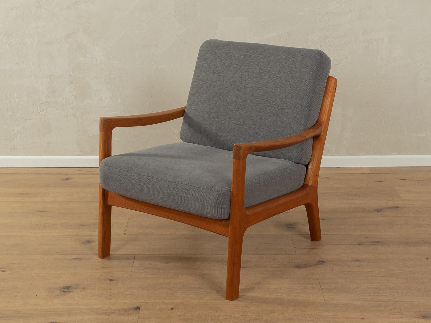 Classic armchair from the 1960s. Model Senator by Ole Wanscher for France & Søn. High-quality solid teak frame. The original spring core has been reupholstered and covered with a high-quality fabric in grey.

Quality Features:

    accomplished