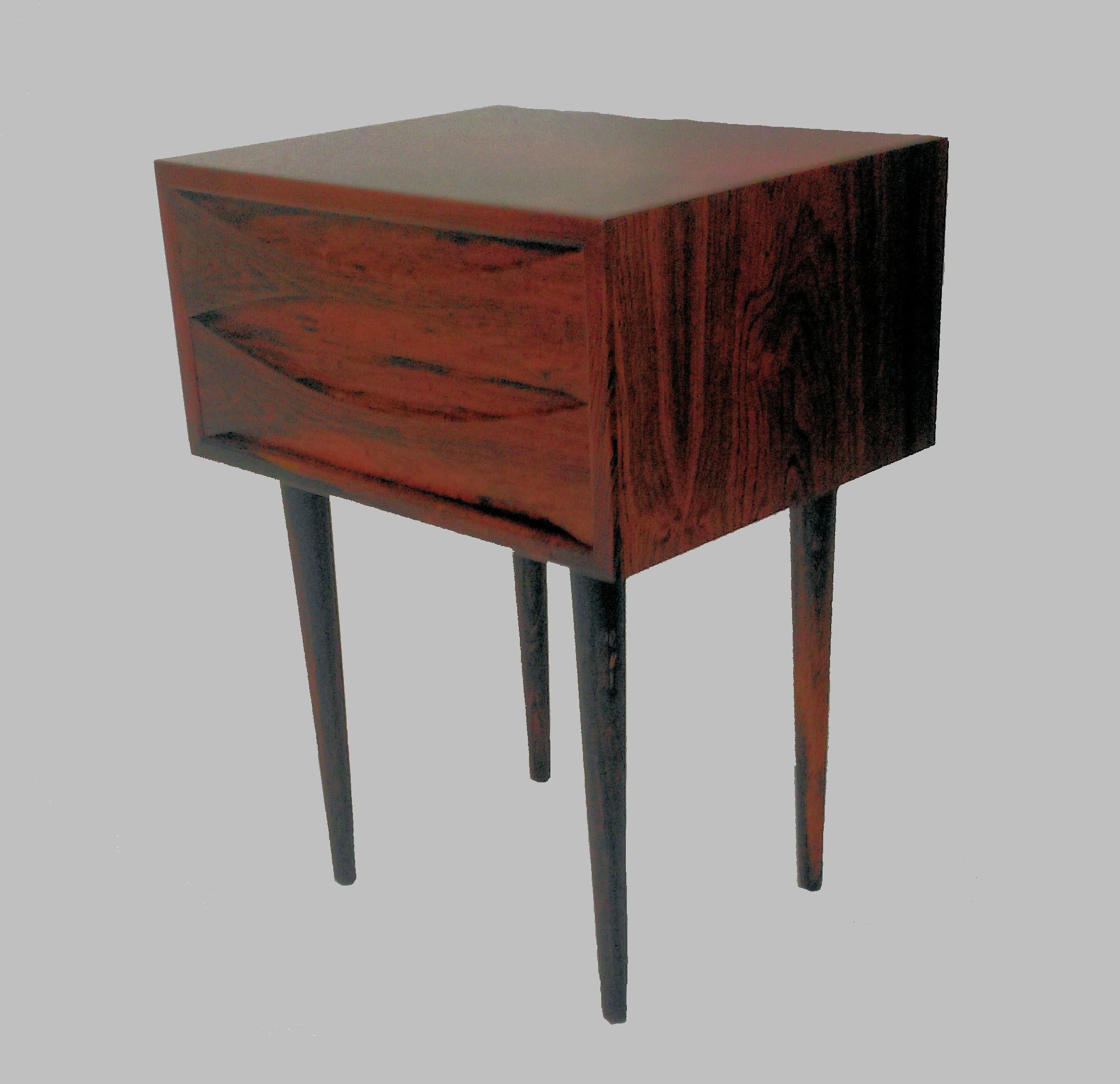 Rare set of Danish modern rosewood night tables by most attributed to Arne Vodder.

The night stands feature excellent design and craftmanship and have been overlooked and refinished by our cabinetmaker to ensure that they are in good condition.