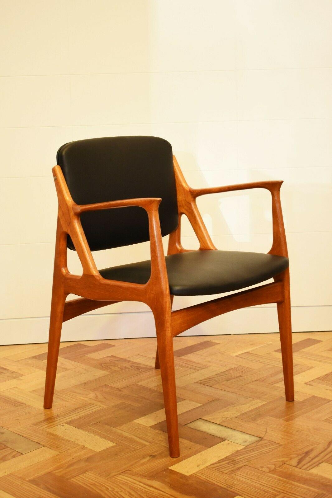 1960s Danish Arne Vodder 'Ella' armchair in teakwood and leather for Vamo

Extremely rare, this armchair features a black leather upholstered seat and back, which appear to float within the teakwood sculptural frame.


About the Designer:
Arne