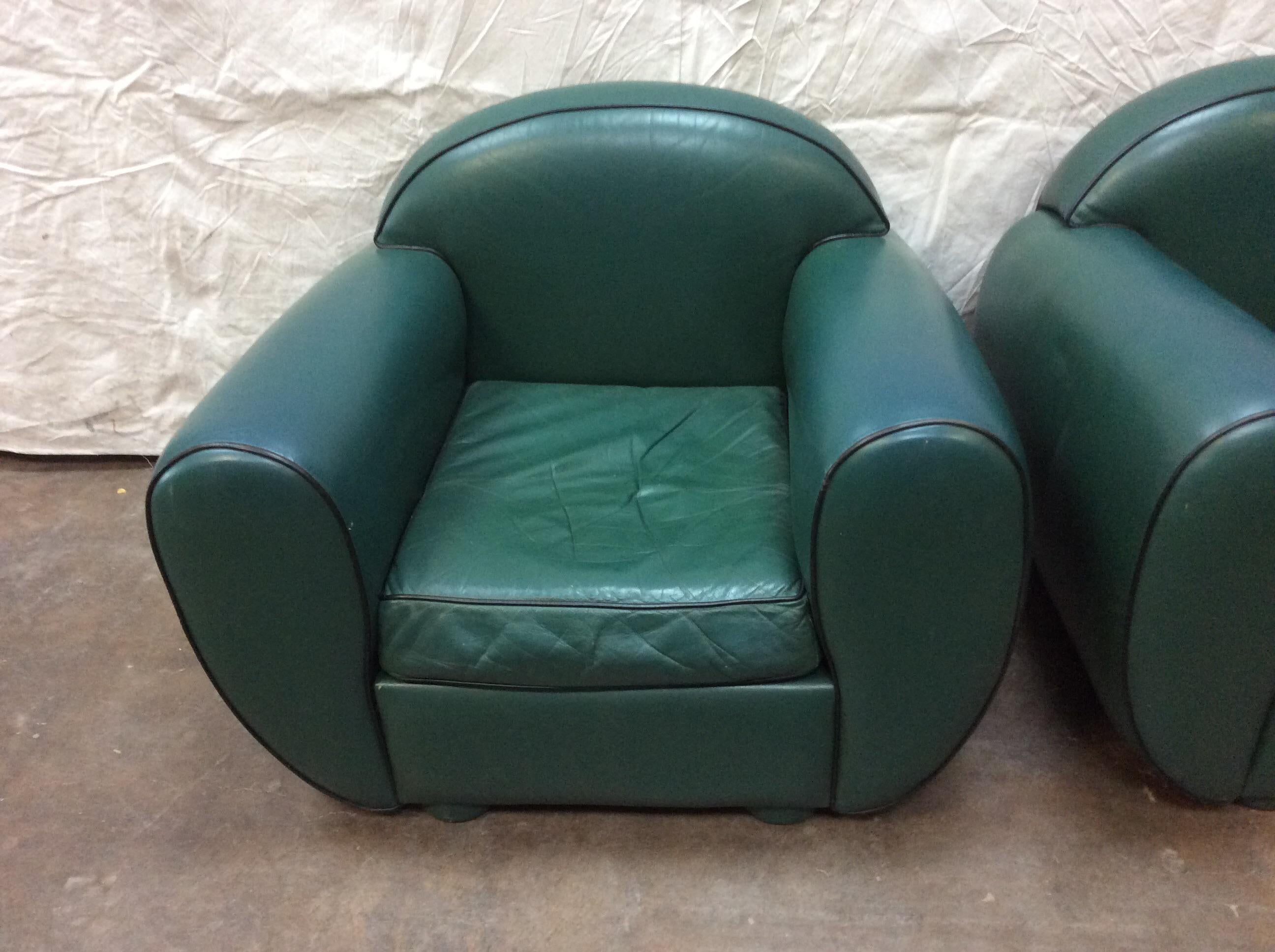 This pair of Art Deco style lounge chairs in green leather were made in Denmark in the 1960's. The chairs feature a well-loved patina with soft leather, the bun feet are also covered in leather.
Stylish and comfortable these chairs will surely add
