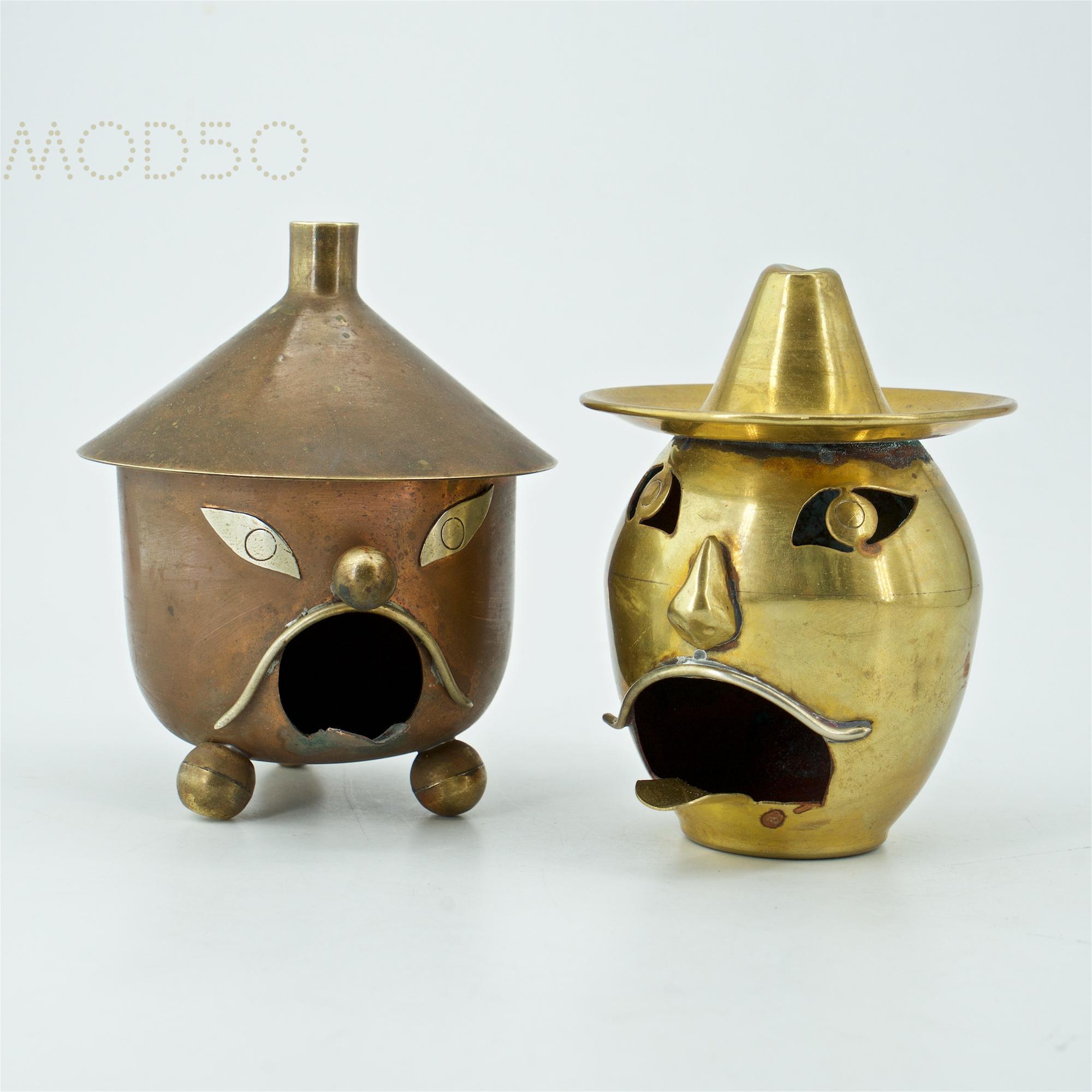 Pair of Banditos lantern / smokestack ashtrays. Many new uses, wonderful small objects. Relics from beyond the border. The stout copper one has a shadow of a label and is Dm 3.75 x H 4 in. The brass one, and is stamped, hecho en mexico, and is Dm