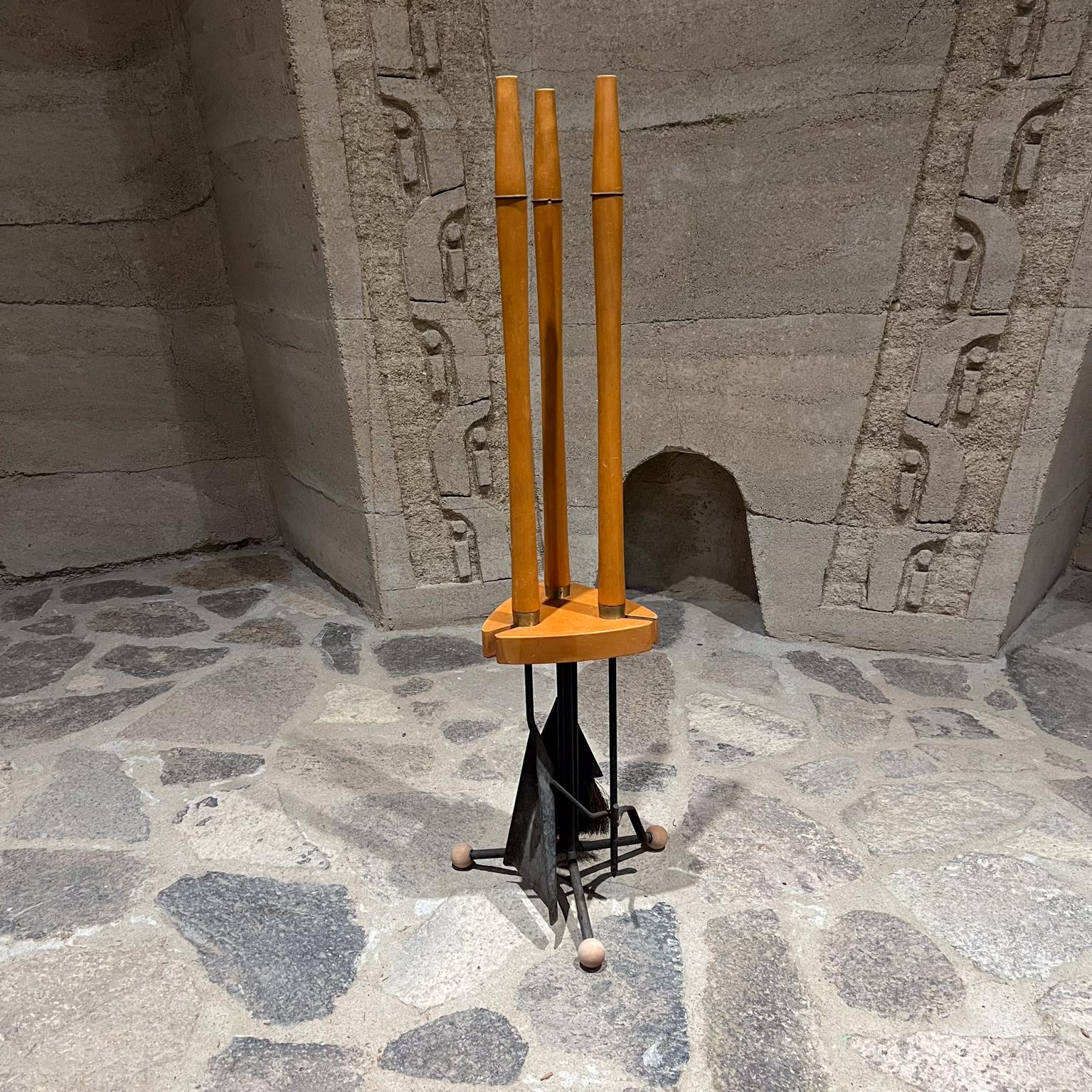 Midcentury Modern Sculptural Maple Wood & Black Iron Fireplace Tool Set
Made in USA 1960s.
Unmarked attributed Arthur Umanoff.
Expect Original vintage condition & patina. 
Ball feet replaced.
Please see all images.
37.5 h x 11 diameter