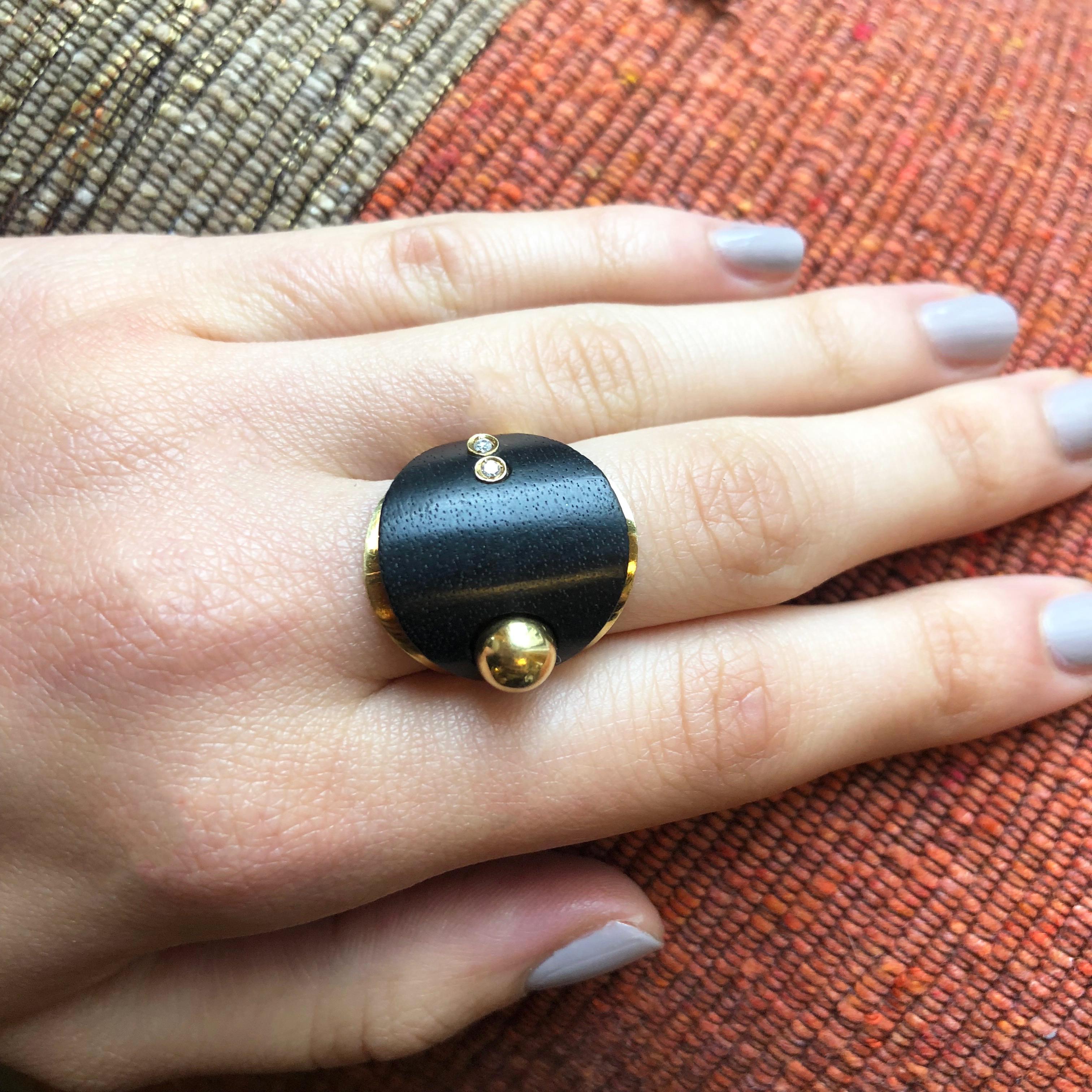 A one of a kind diamond, ebony, and 18 karat gold ring, by Italian artist jeweler Paolo Spalla, c. 1960. 

The ring measures a size 6. It is stamped 750, numbered 904AL, and measures 1