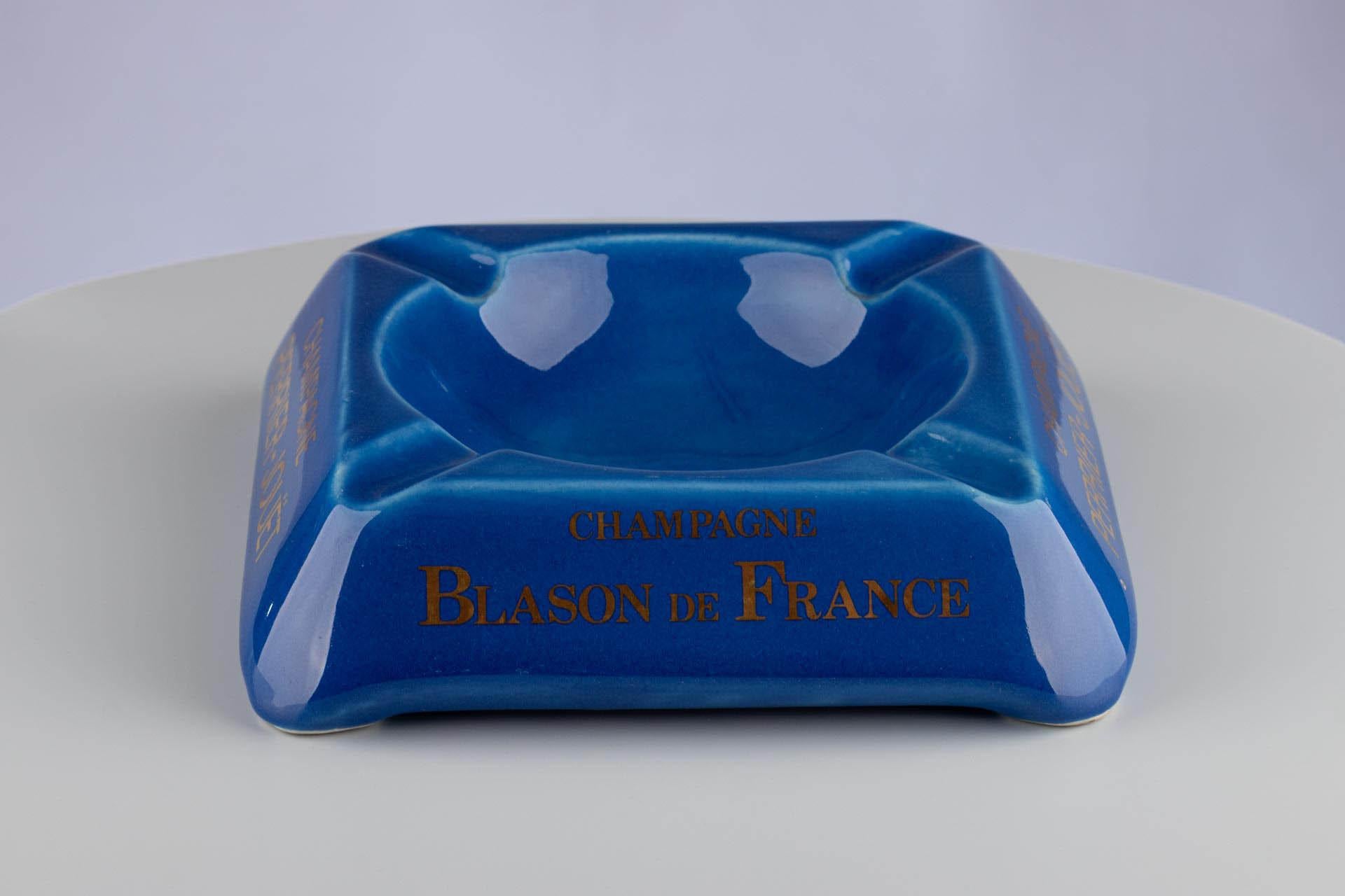 Large ceramic ashtray from the Perrier-Jouet Champagne producer. 
Glazed in a beautiful, rich blue with golden emblem 