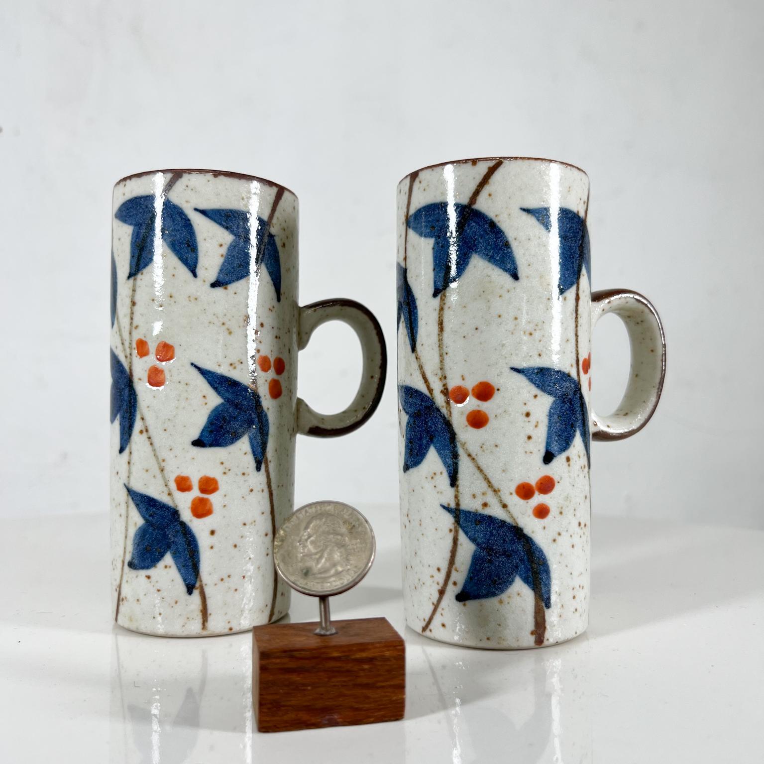 1960s Asian Blue MCM Organic stoneware pottery coffee mugs Hand Painted
5.38 tall x 2.38 diameter x 3.5 d
Preowned unrestored original vintage condition
See images provided.
 
