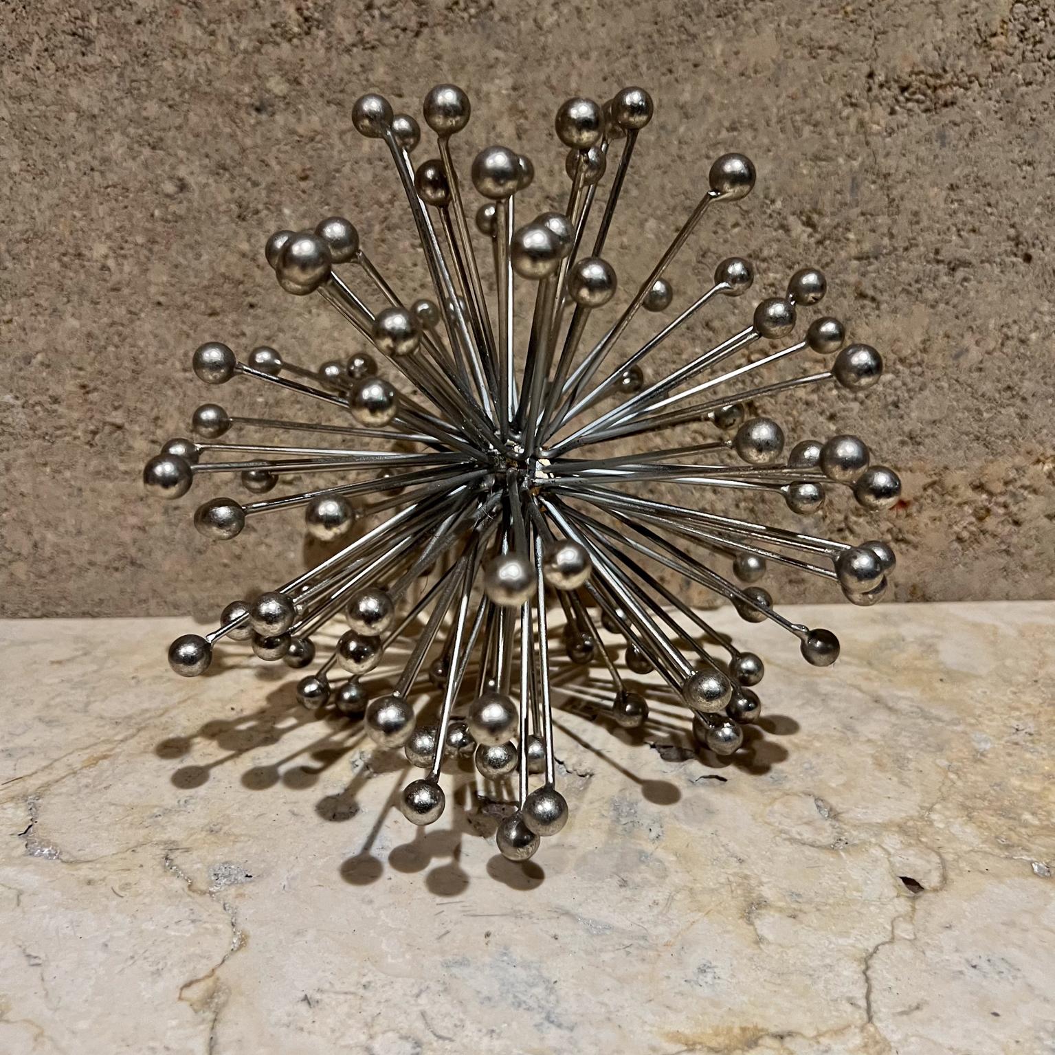 1960s Atomic Decorative Chrome Starburst Table Sculpture
Style of Curtis Jere
7 h x 7 diameter
Chrome plated steel
Overall good condition preowned vintage
Unmarked
Refer to images listed