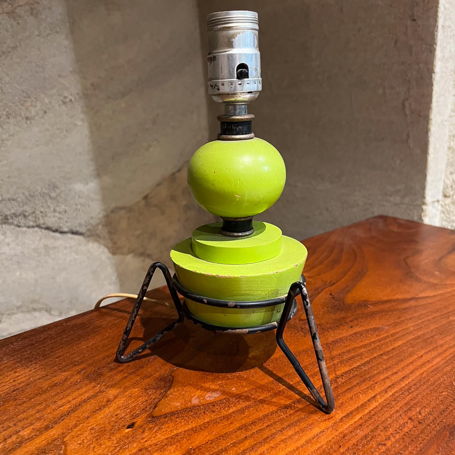
1960s Atomic Lime Green Wood Table Lamp Tripod Iron Base
California atomic design.
No label. After Arthur Umanoff.
6.5 diameter x 10 h
Original vintage condition unrestored. Original wiring. No shade included.
Tested and currently working. Wear and