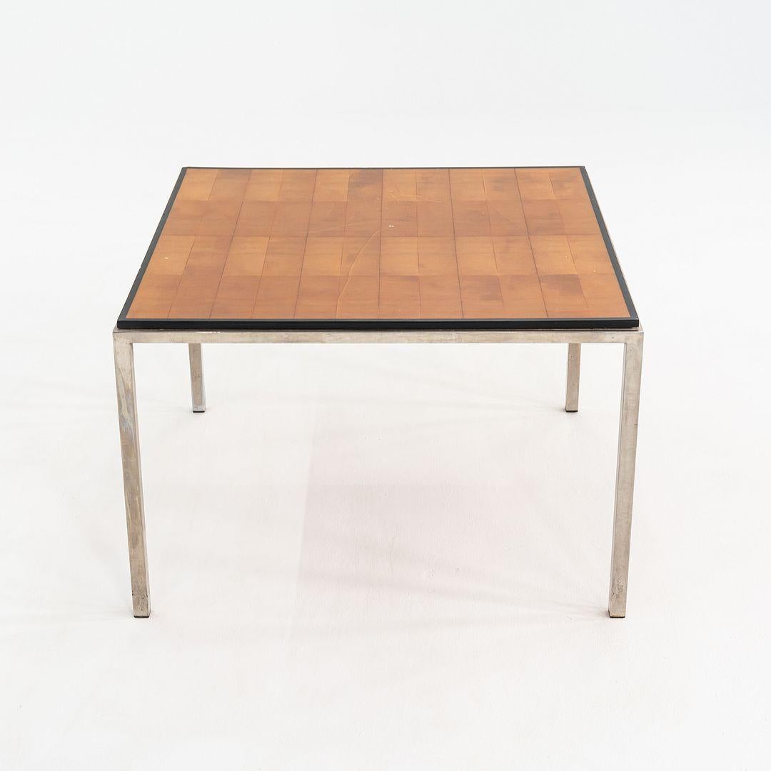 This is a 1960s Square Wood and Steel Side Table, attributed to Gordon Bunshaft and Davis Allen of Skidmore, Owings, and Merrill (SOM). The base is composed of stainless steel and the top is a butcher block with ebonized and lacquered wood framing