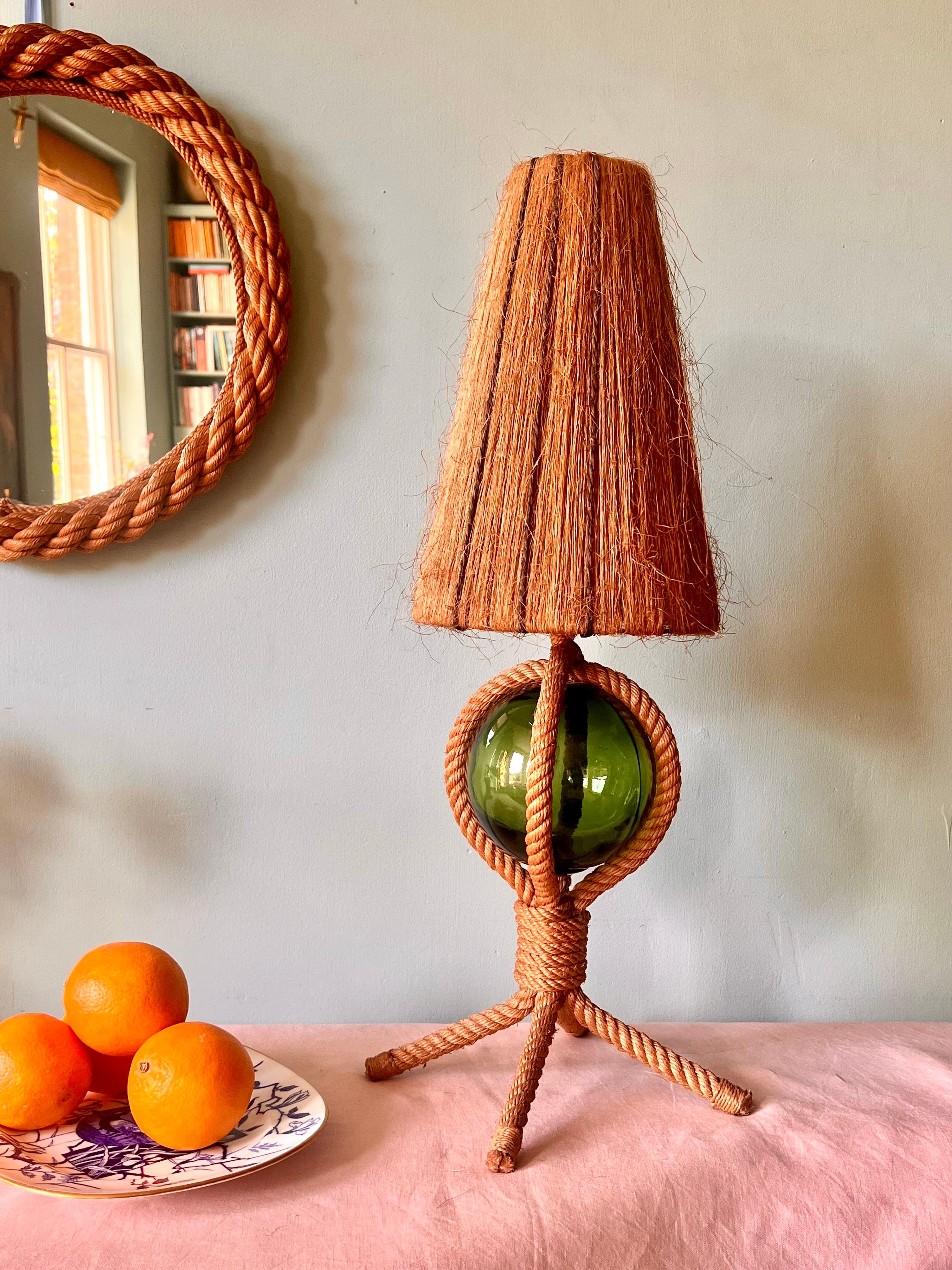 1960s Audoux Minet rope and float lamp.

Superb mid-century rope and glass fishing float lamp by the celebrated French design duo Adrien Audoux and Frida Minet. 

In excellent condition, the light has been rewired with 2 metre fabric chord and PAT