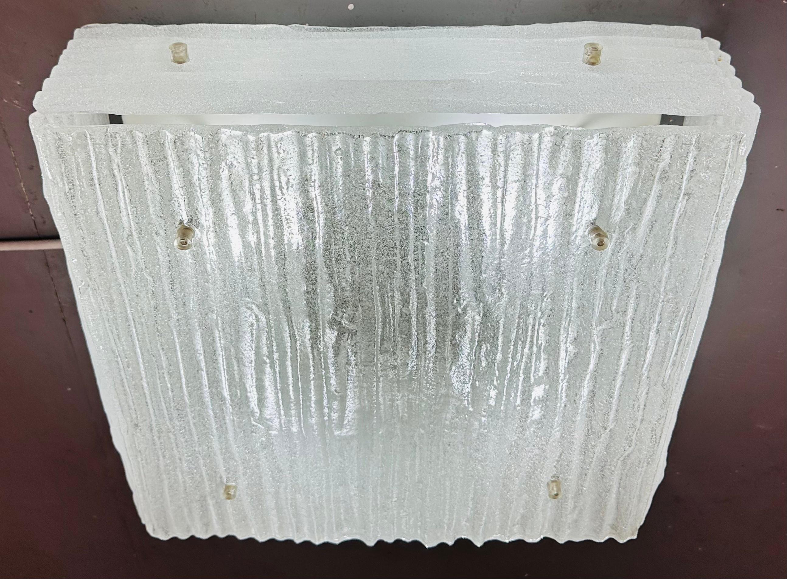 1960s Austrian flush mount ceiling light manufactured by Kalmar Leuchten. The flush mount features four thick rippled Murano frosted glass sides and one large element attached to a white metal frame. The glass is secured onto the frame with screws