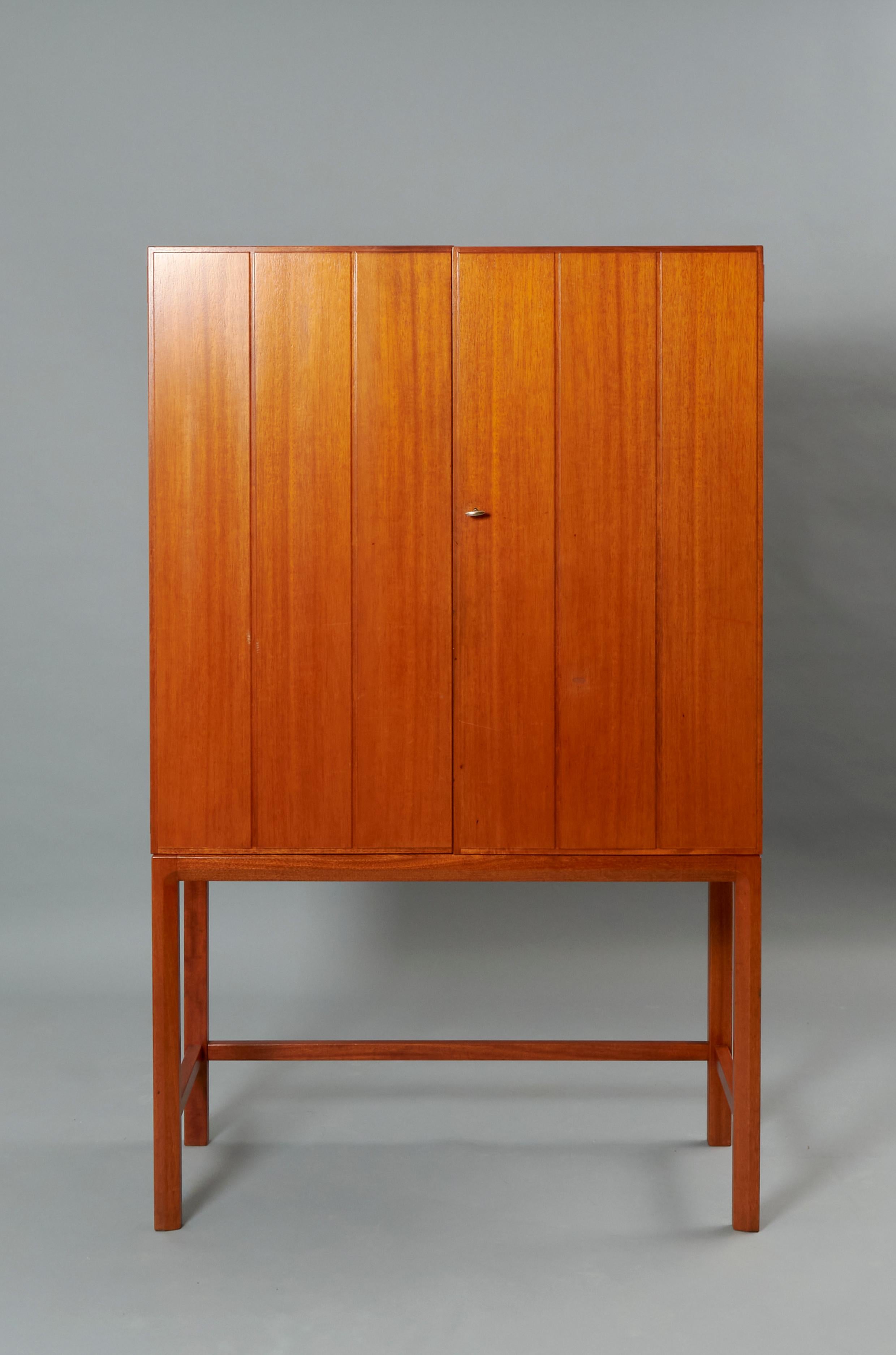 Axel Larsson’s model ‘’a-147’’ teak and birch cabinet for AB Svenska Möbelfabrikerna. Sweden, 1960s. Excellent restored condition that may present traces of use. 
Two available. 
Axel Larsson (1898-1975was a Swedish interior designer working