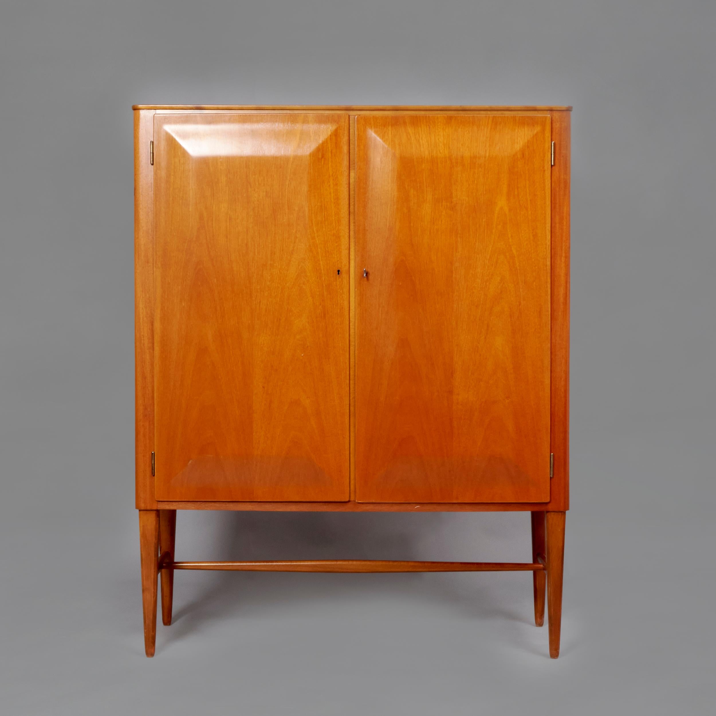 Cabinet in modelled Mahogany wood designed by Axel Larsson for Bodafors. Sweden, 60s. Excellent restored condition that might present slight traces of use.
Axel Larsson was a Swedish interior and furniture designer who worked for Svenska