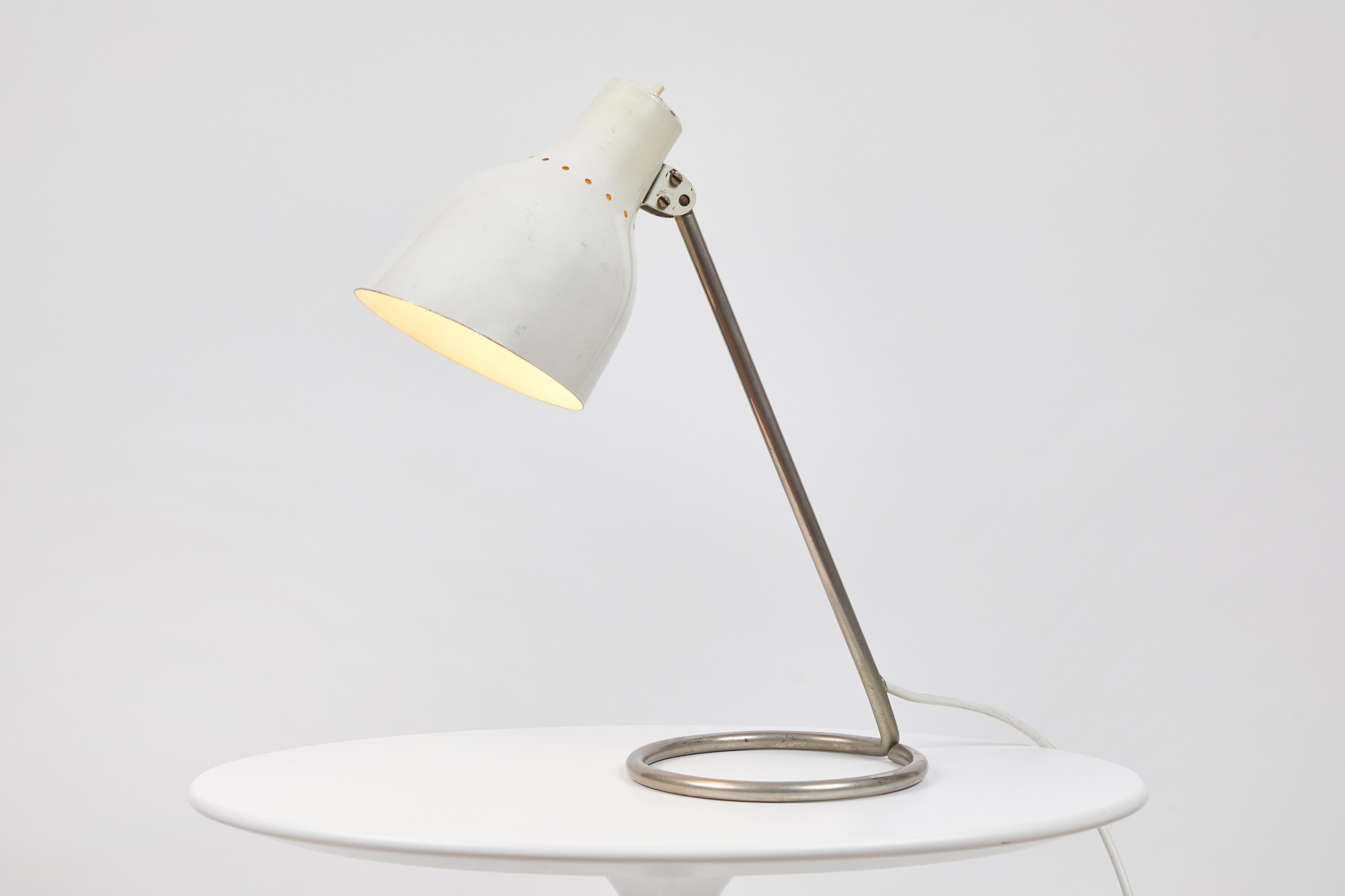 1960s BAG Turgi white table lamp. Executed in white enameled metal and nickel or steel. Shade adjusts left/right and up/down. Reminiscent of the refined Minimalist designs of Tito Agnoli for O-Luce.

Not UL listed, but recommended UL listing