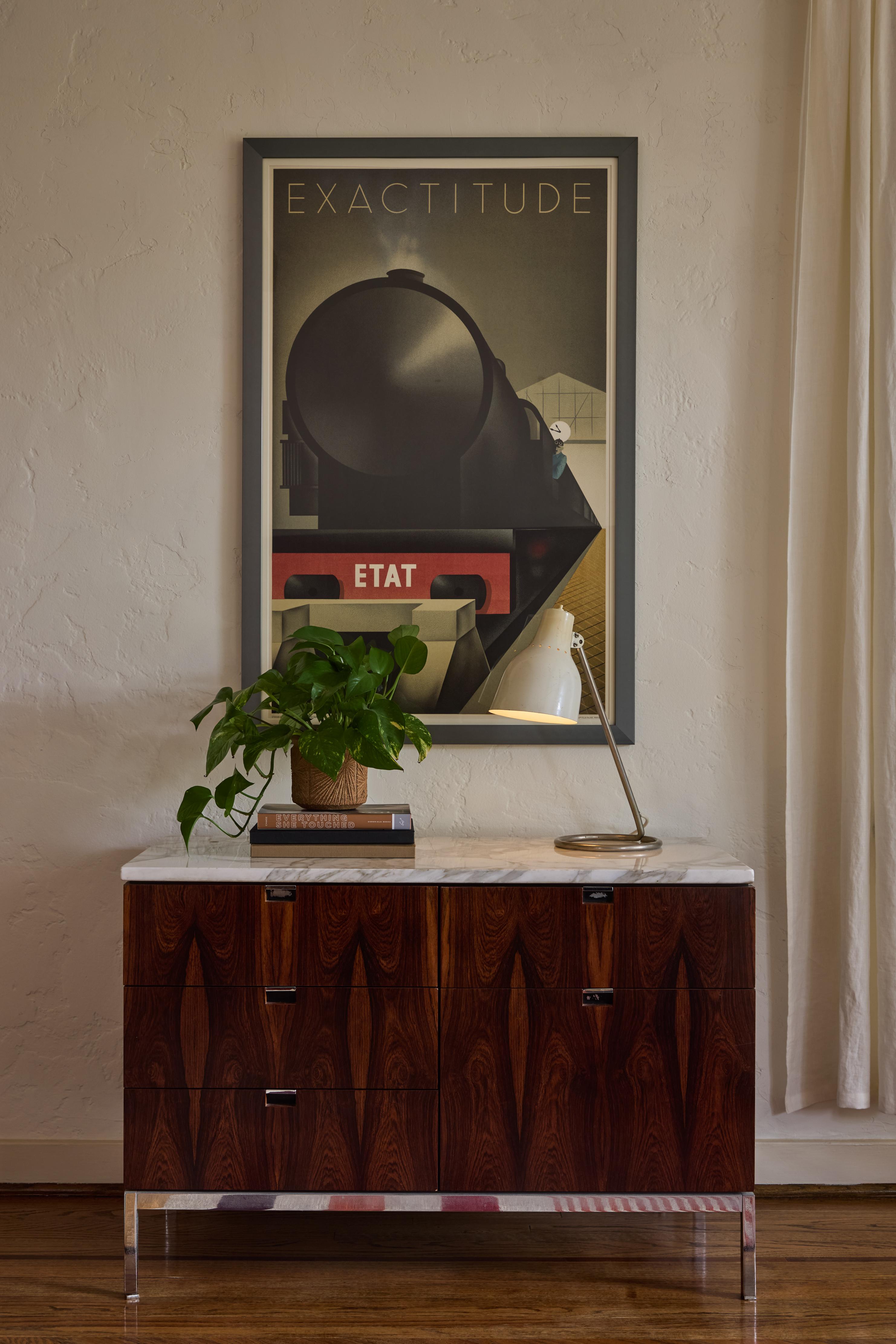 1960s BAG Turgi White Table Lamp.

Executed in a white enameled metal shade with a nickel finish base, this 1960s vintage table lamp is attributed to Swiss lighting house BAG Turgi. The shade adjusts left/right and up/down. The round nickel finish