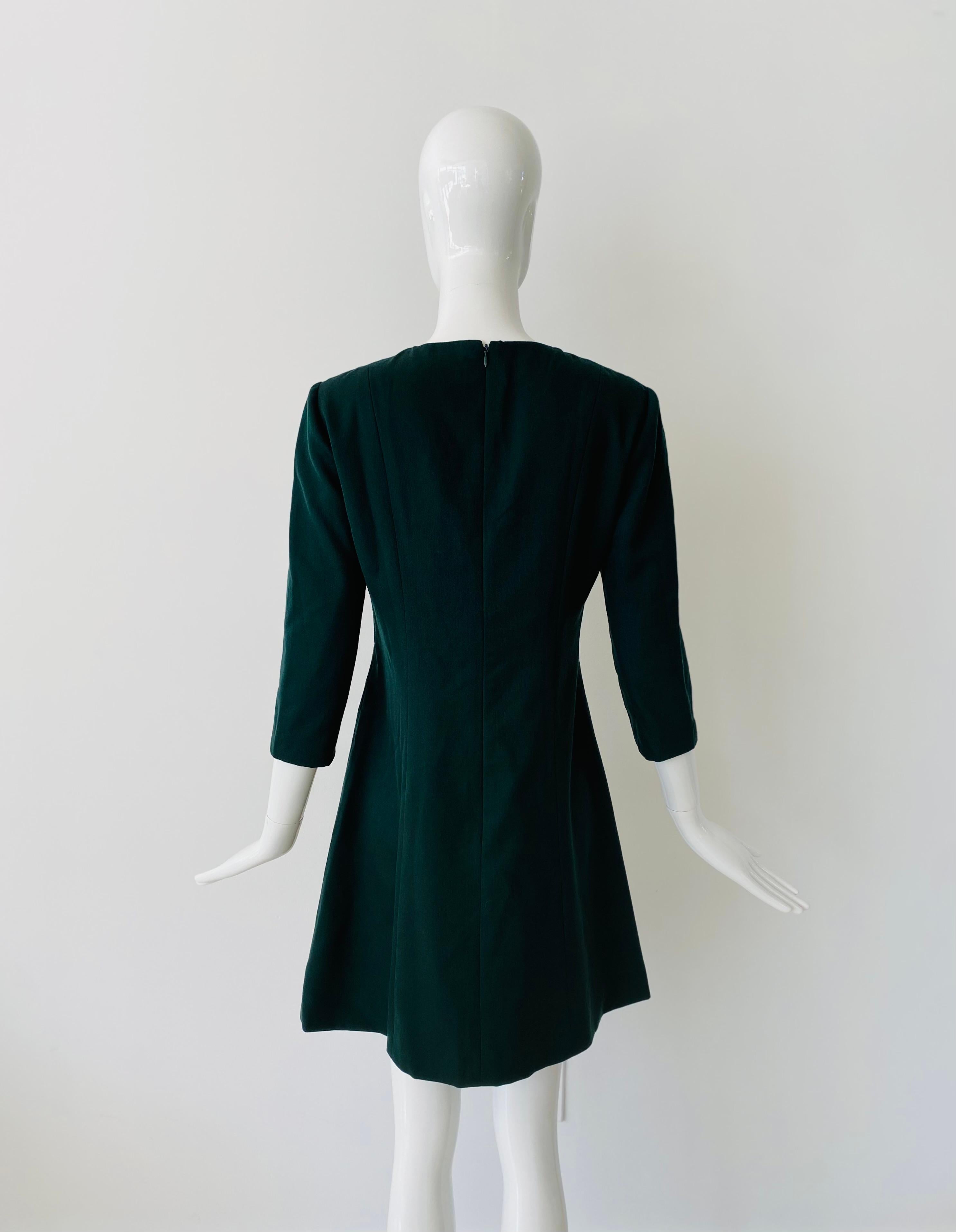 1980s vintage Balenciaga Le Dix wool dress and car coat. The fabric is a beautiful forest green light wool with silk lining. The dress has 3/4 sleeves, a high round neckline, a slightly fitted waist silhouette and flared skirt that falls right above