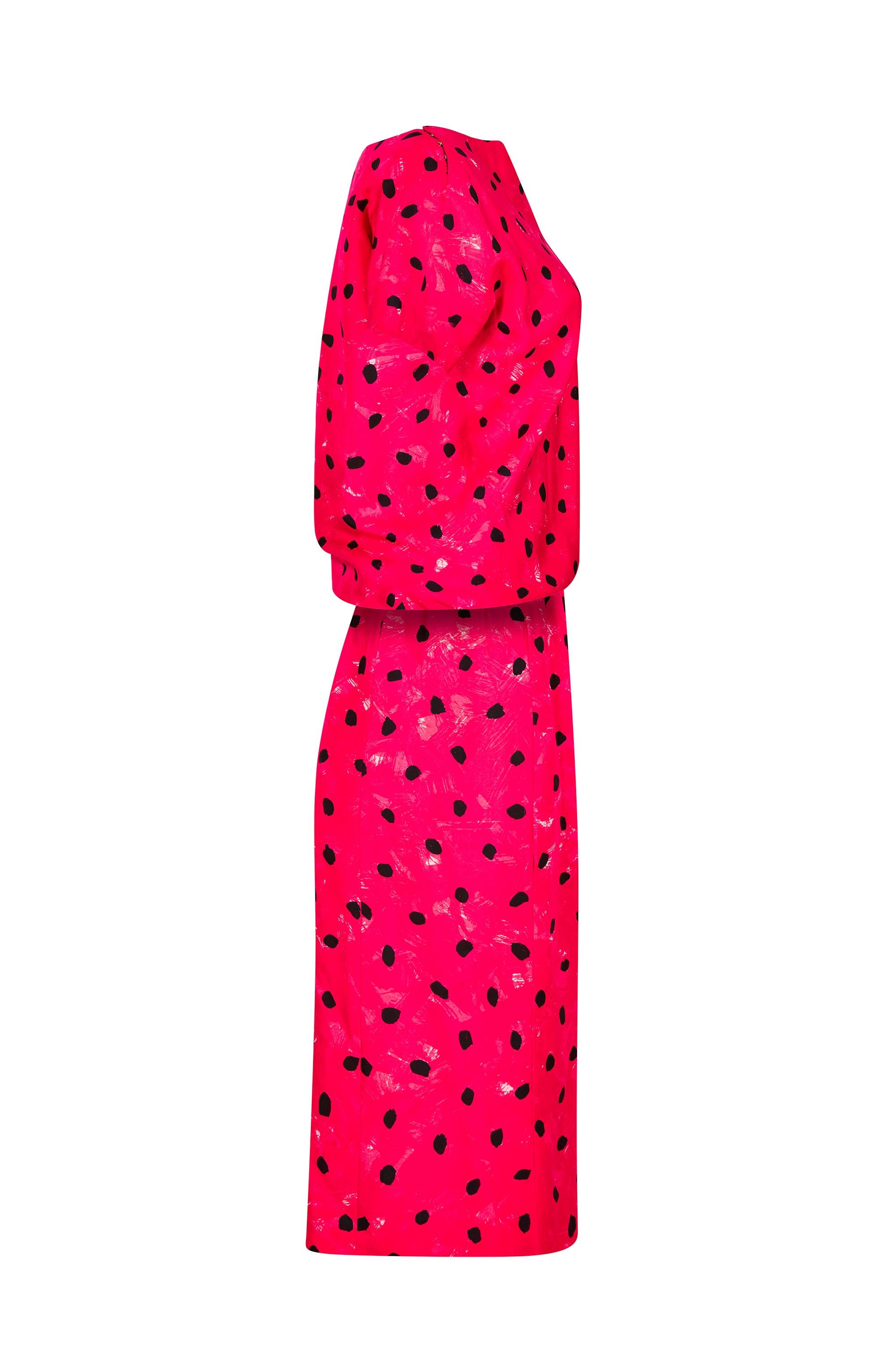 This divine 1960s printed silk top and skirt ensemble is haute couture from coveted label Balenciaga and has elegant line with some immaculate tailoring. The silk fabric is printed with irregular black dalmatian spots over a textured deep pink and